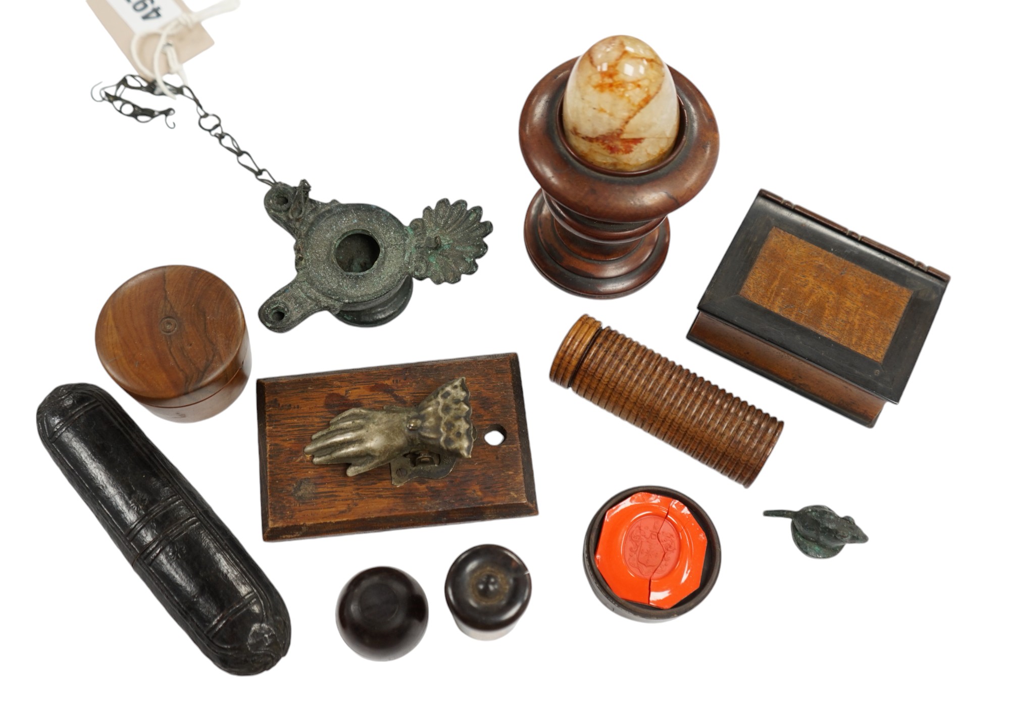 A Blue John type egg, in a carved wood stand, an early 19th century bronze oil lamp, spectacles in case, a hand letter clip, a boxed seal and other collectables, turned egg stand 8.5cm high (12). Condition - Varies, Cond