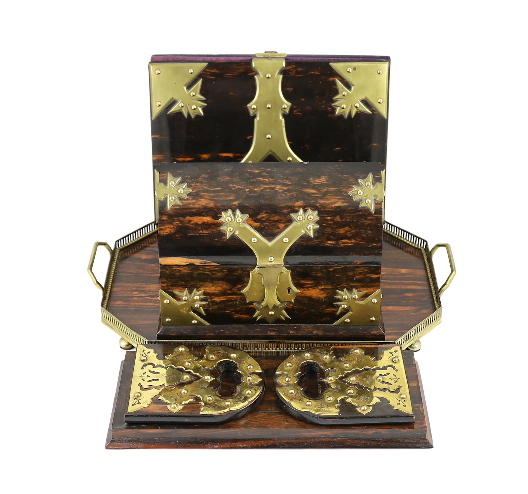 A Victorian brass mounted coromandel wood stationery casket with matching blotter, a similar book rack and gallery tray, 26cm                                                                                               