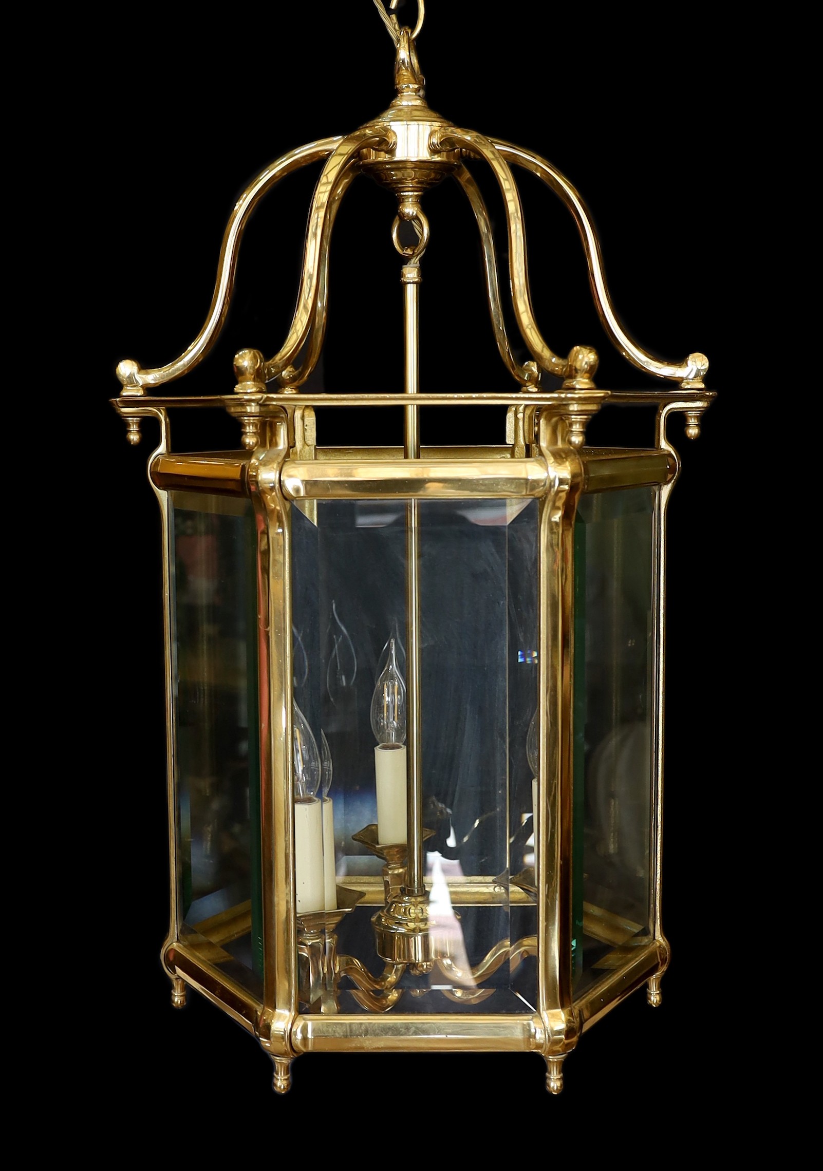 A large 18th century style hexagonal brass hall lantern with bevelled glass panels, height 78cm. width 48cm                                                                                                                 