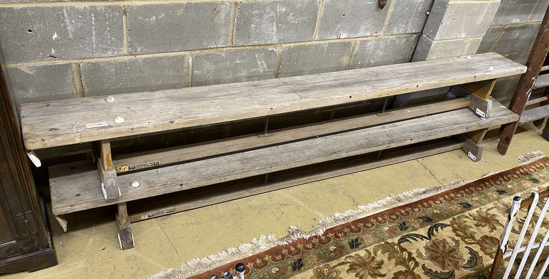 A pair of vintage gym benches, length 267cm, depth 25cm, height 31cm                                                                                                                                                        