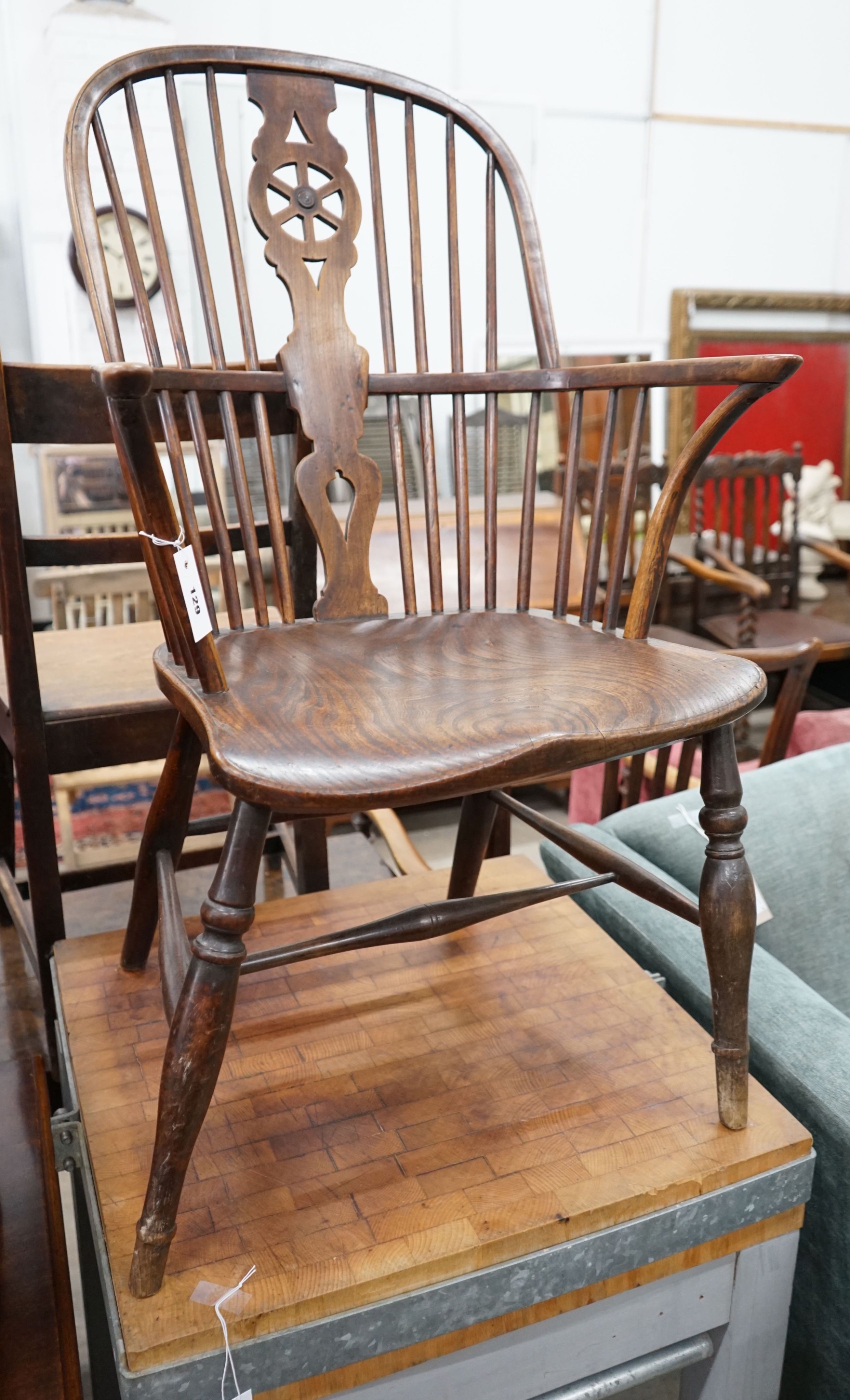 A 19th century ash, elm and beech Windsor wheelback armchair, width 57cm, depth 43cm, height 98cm                                                                                                                           