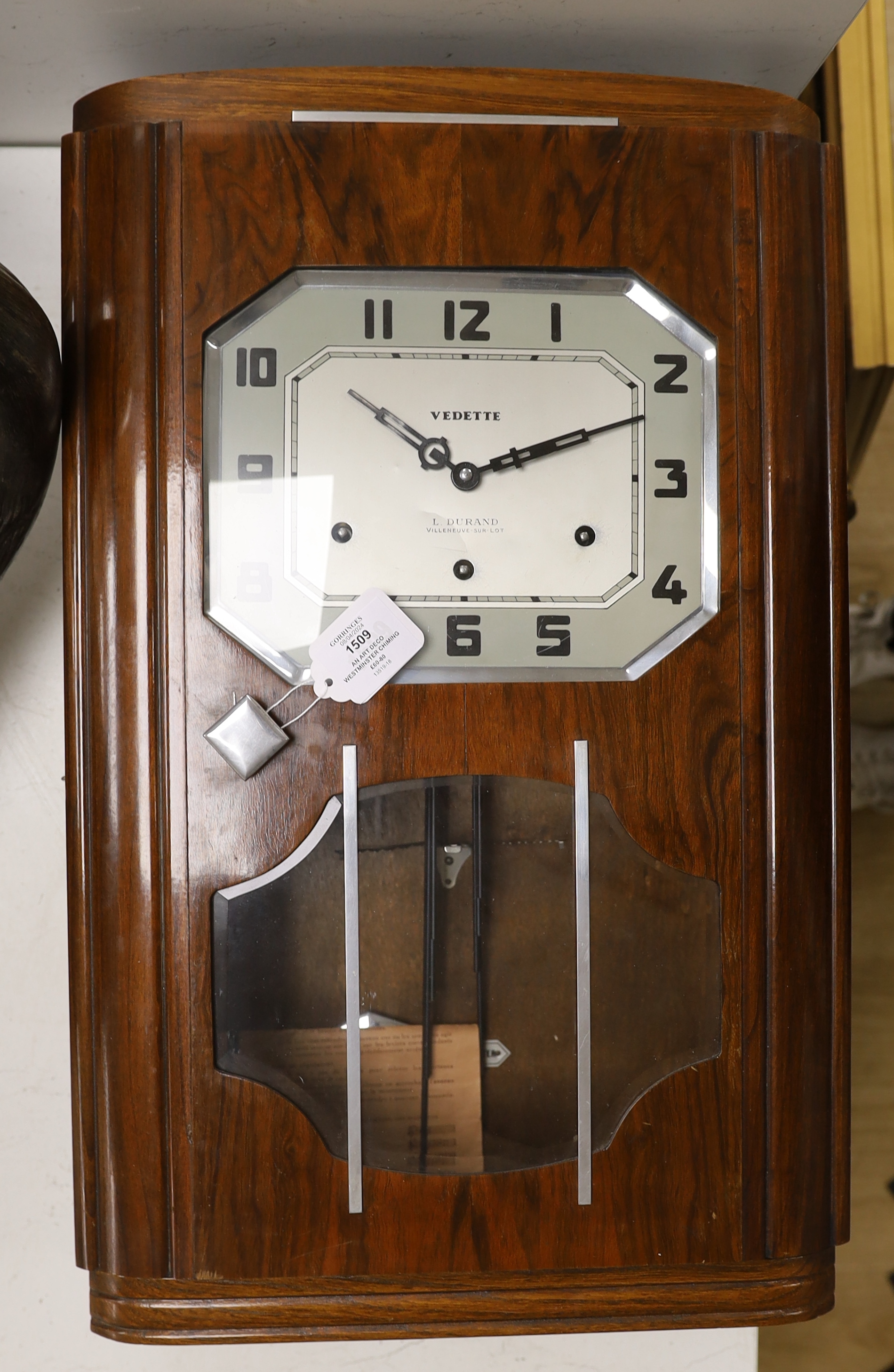 An Art Deco Westminster chiming walnut wall clock                                                                                                                                                                           