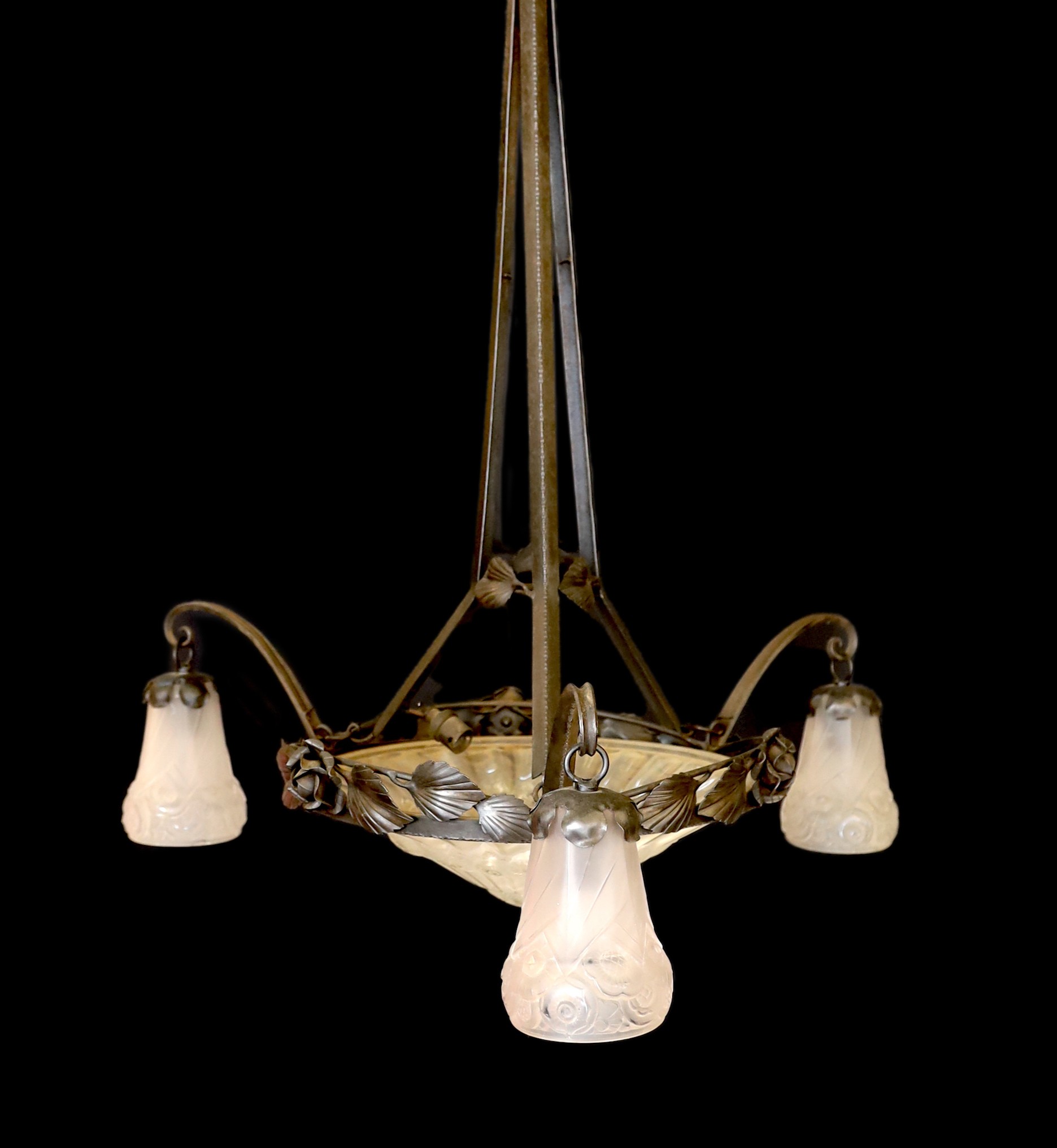 A 1930s French wrought iron and frosted glass light fitting, in the manner of Edgar Brandt with Sabino style shades, height 80cm. width 60cm                                                                                