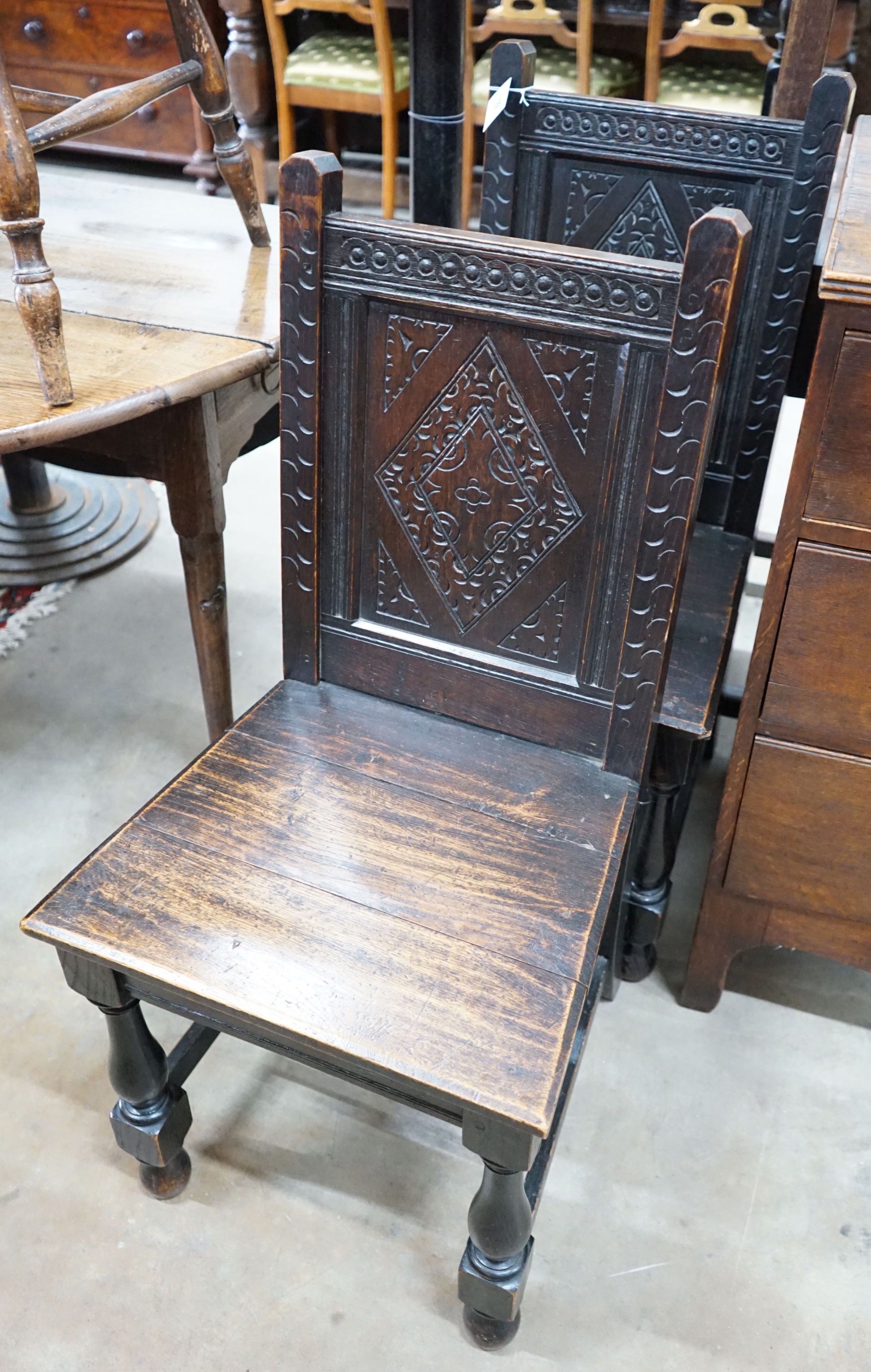 A pair of late Victorian 17th century style carved oak side chairs                                                                                                                                                          