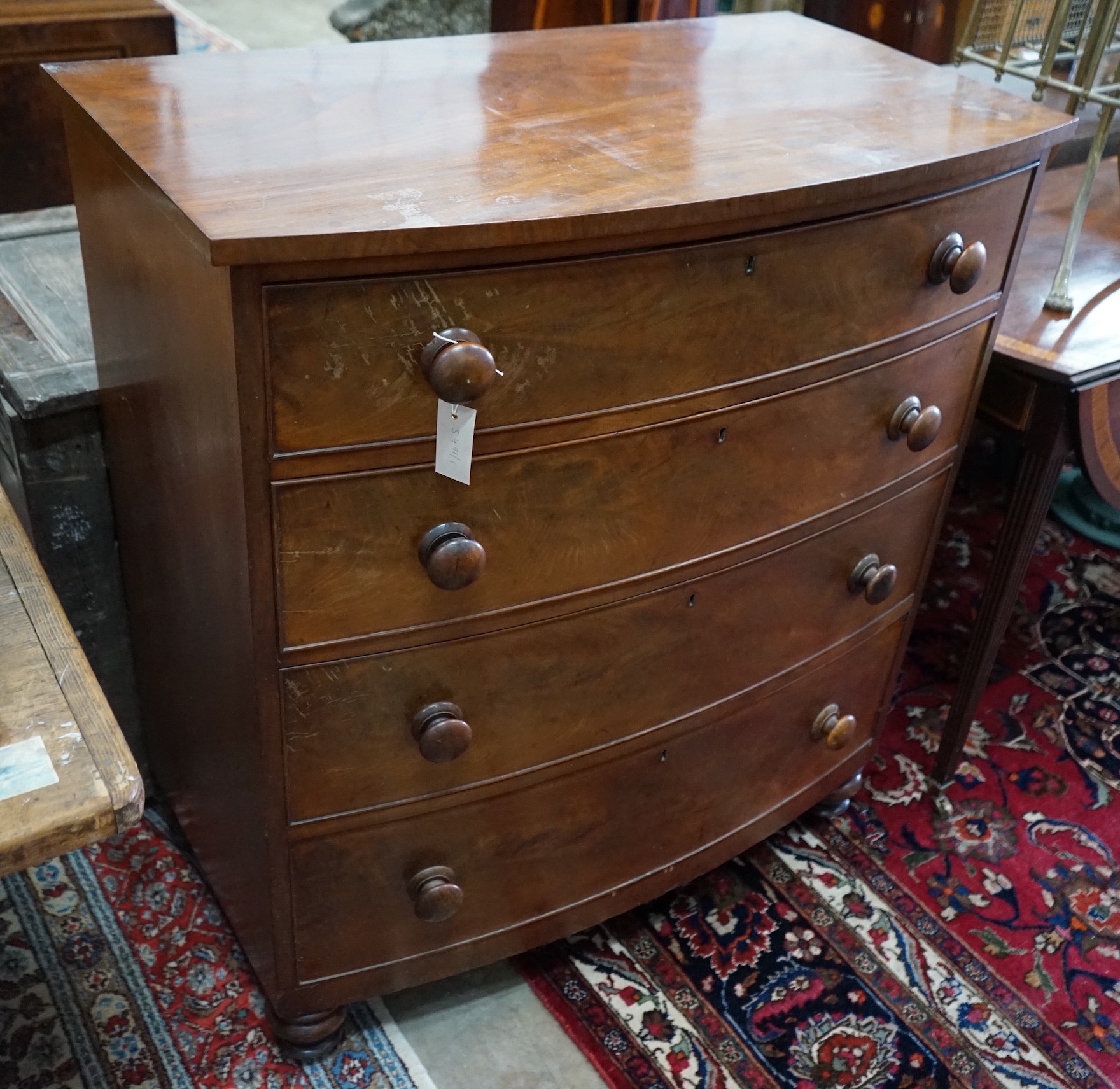 A Regency mahogany bow front chest of four long drawers, width 95cm, depth 54cm, height 106cm                                                                                                                               