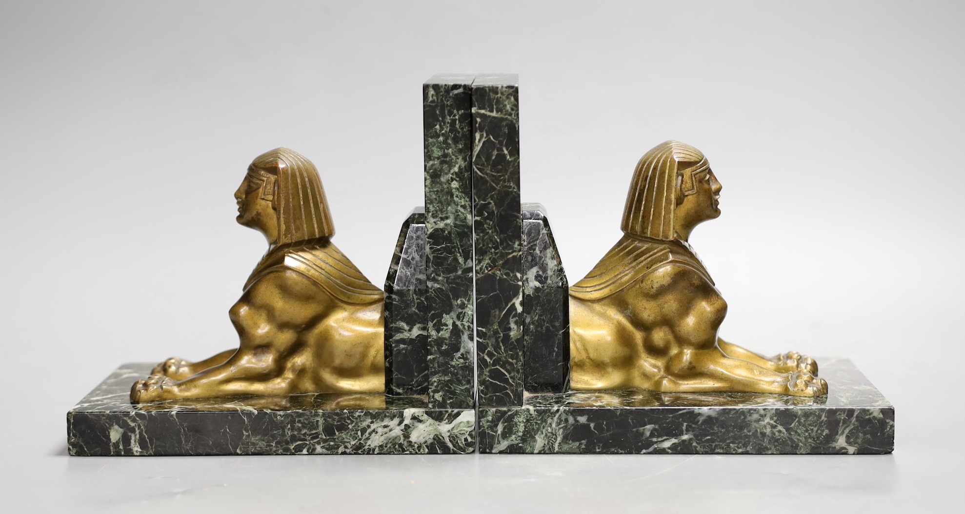 A pair of bronze and marble 'sphynx' bookends, 17cms wide x 15cms high                                                                                                                                                      