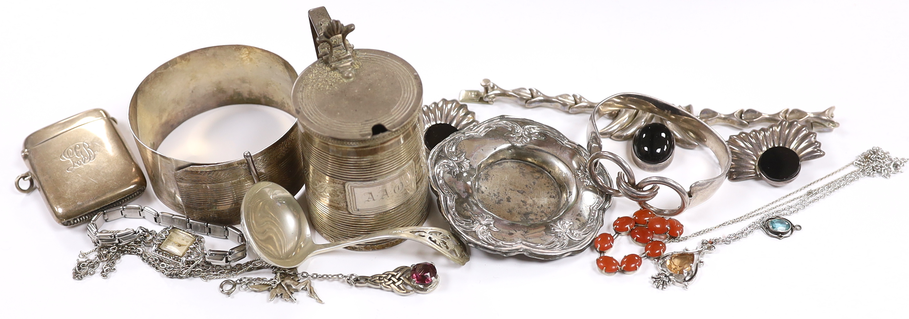 A small group of sterling or white metal jewellery, including a sterling bangle, together with a George III reeded silver mustard pot, London, 1802, silver vesta case and a silver ladle.                                  