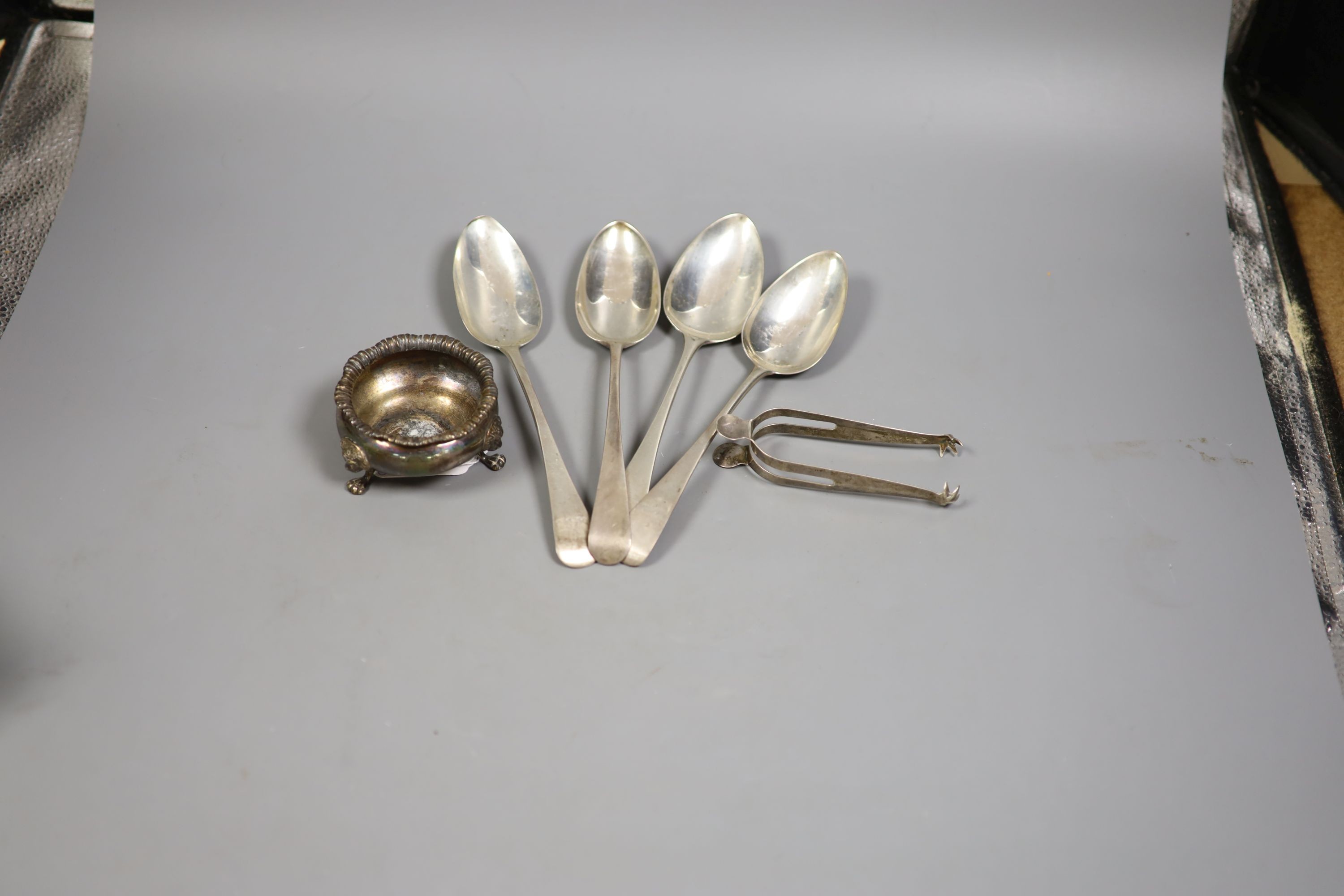Four various George III silver Old English pattern tablespoons, a later silver salt and pair of silver sugar tongs, 11oz.                                                                                                   