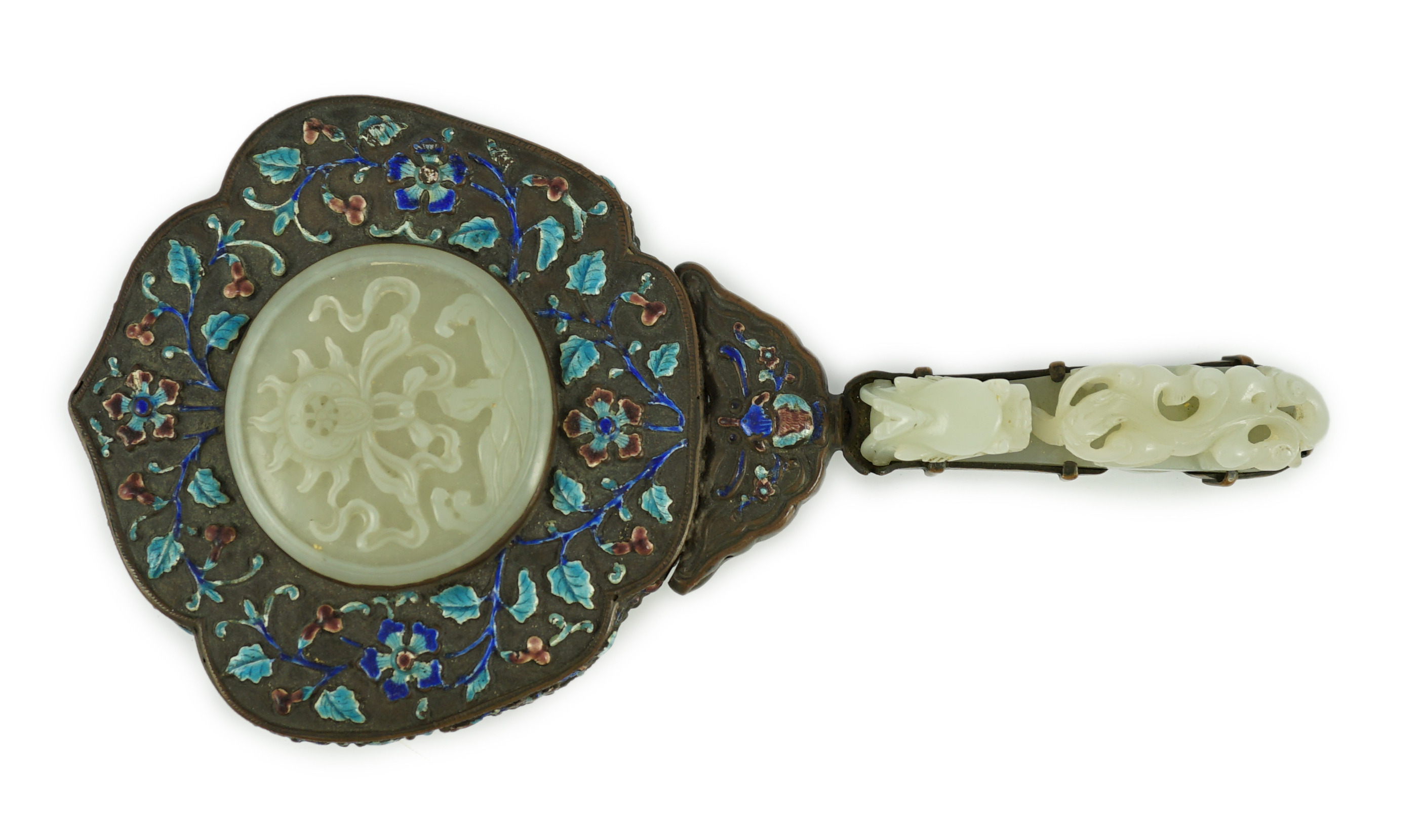 An early 20th century Chinese enamelled copper hand mirror with 18th/19th century Chinese pale celadon jade mounts                                                                                                          