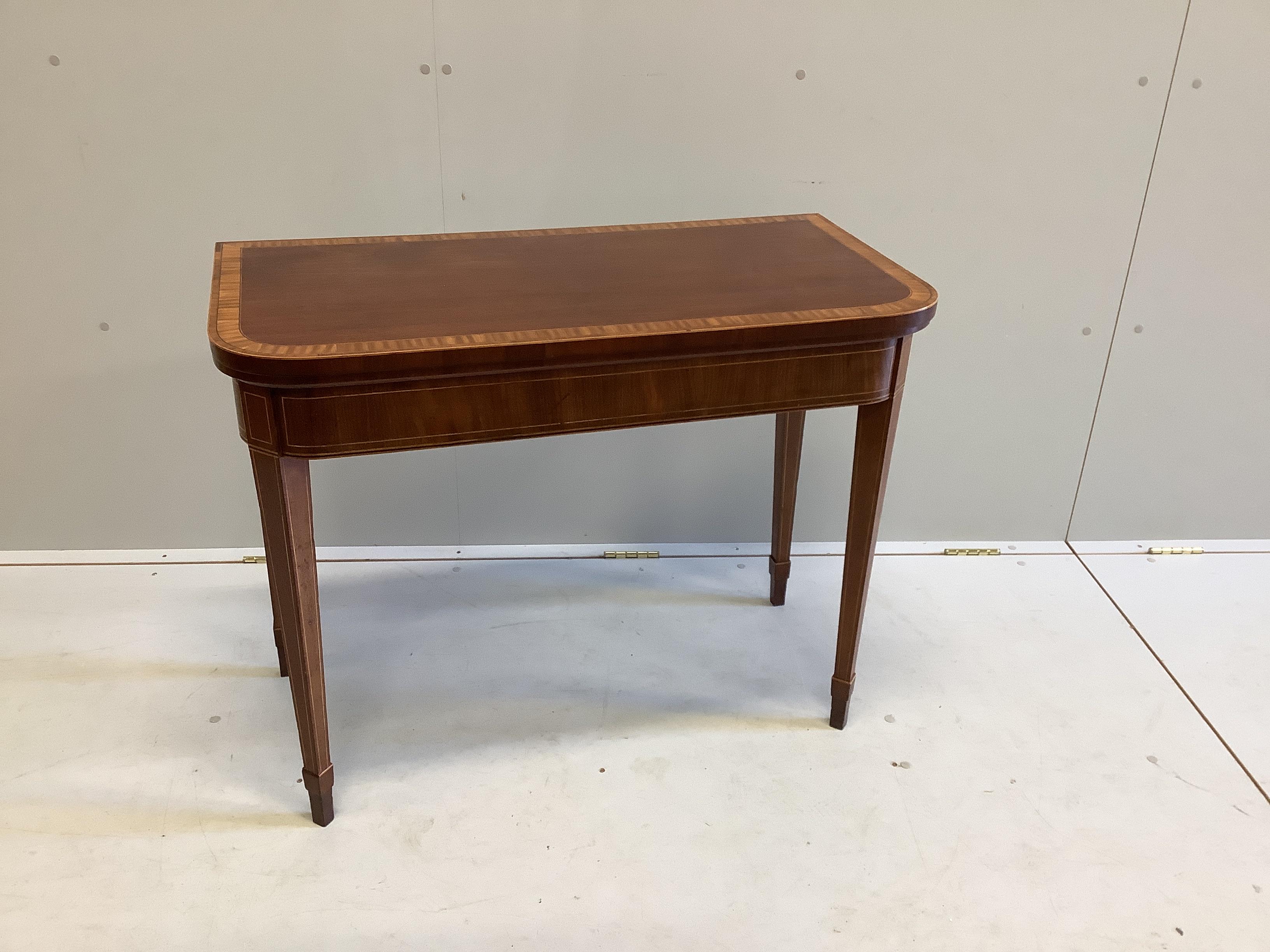 A George III satinwood banded mahogany folding card table, width 90cm, depth 45cm, height 71cm                                                                                                                              