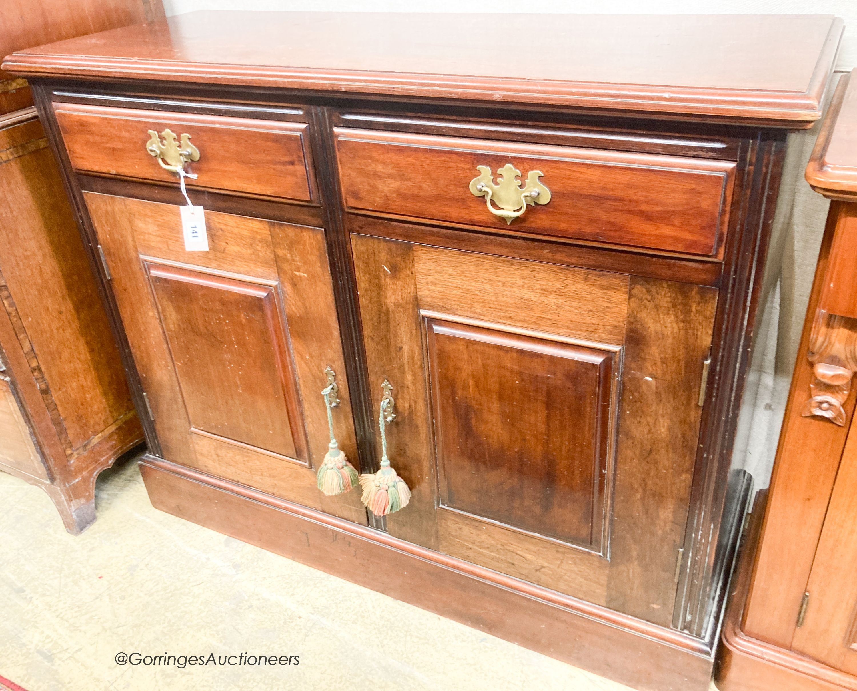 A late Victorian mahogany side cabinet, width 117cm, depth 44cm, height 96cm                                                                                                                                                