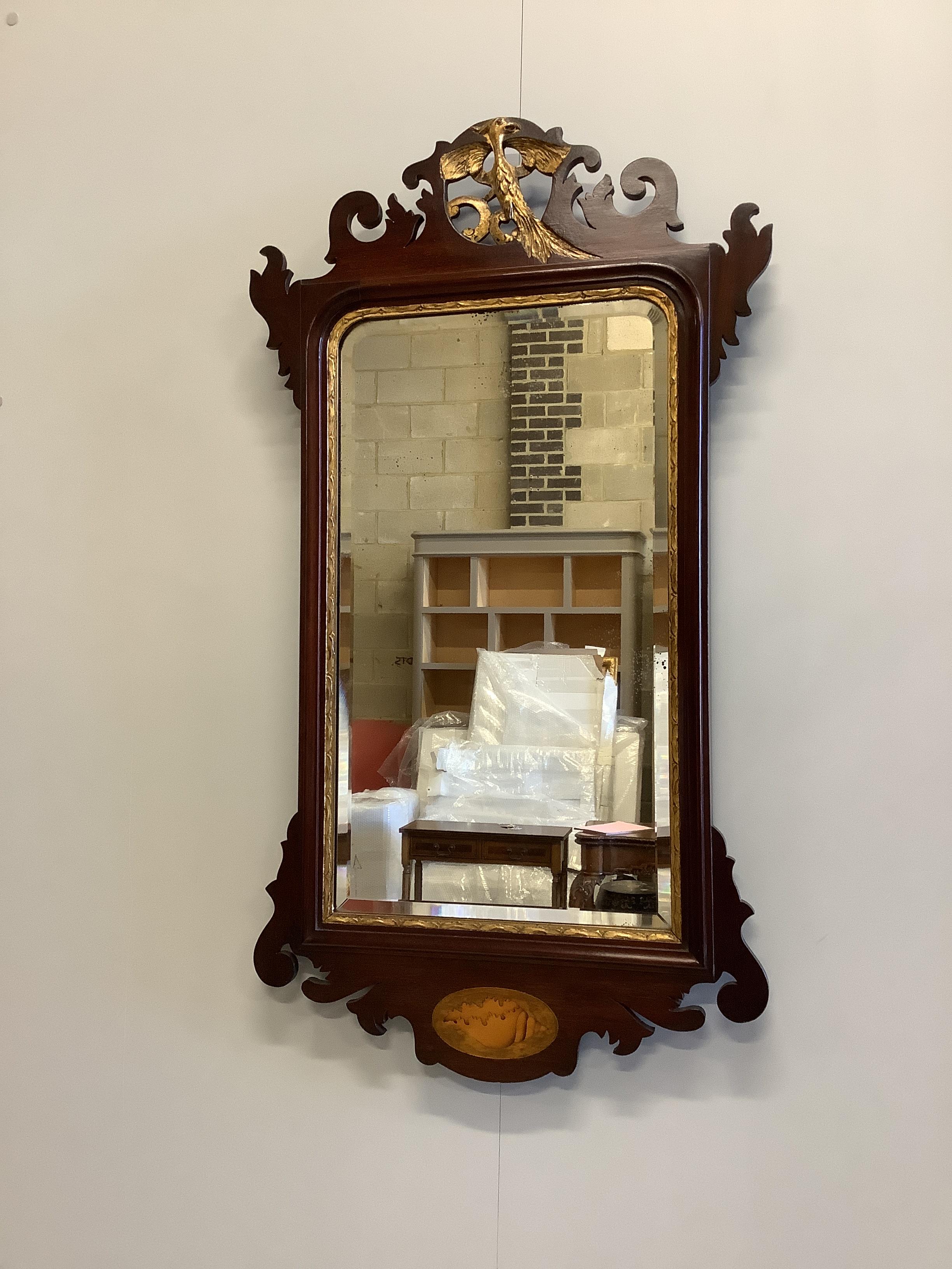 A George III style inlaid mahogany fret cut wall mirror, width 50cm, height 90cm                                                                                                                                            