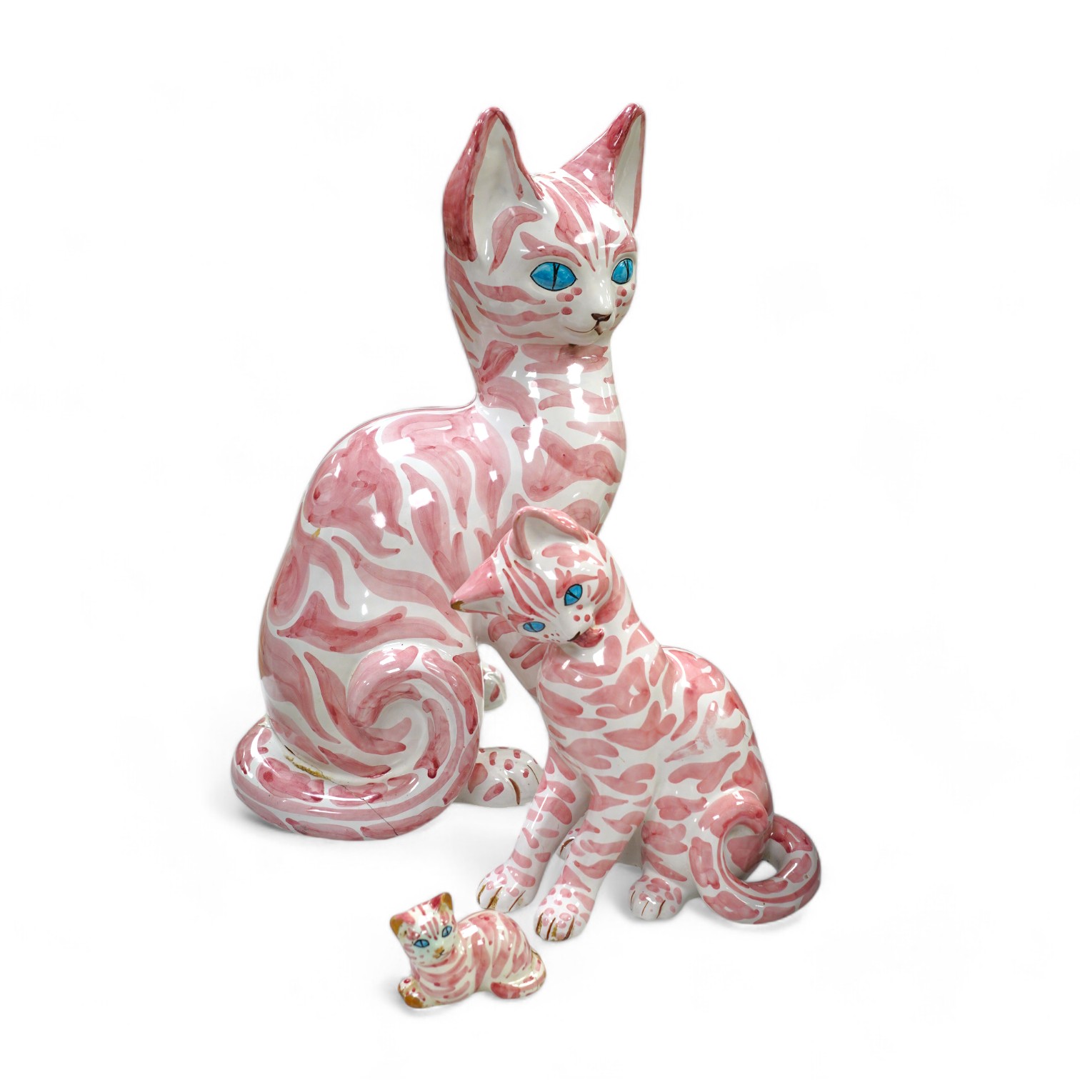 A large 1950's Italian pink maiolica seated cat and two smaller, largest 45cm. Condition - poor                                                                                                                             