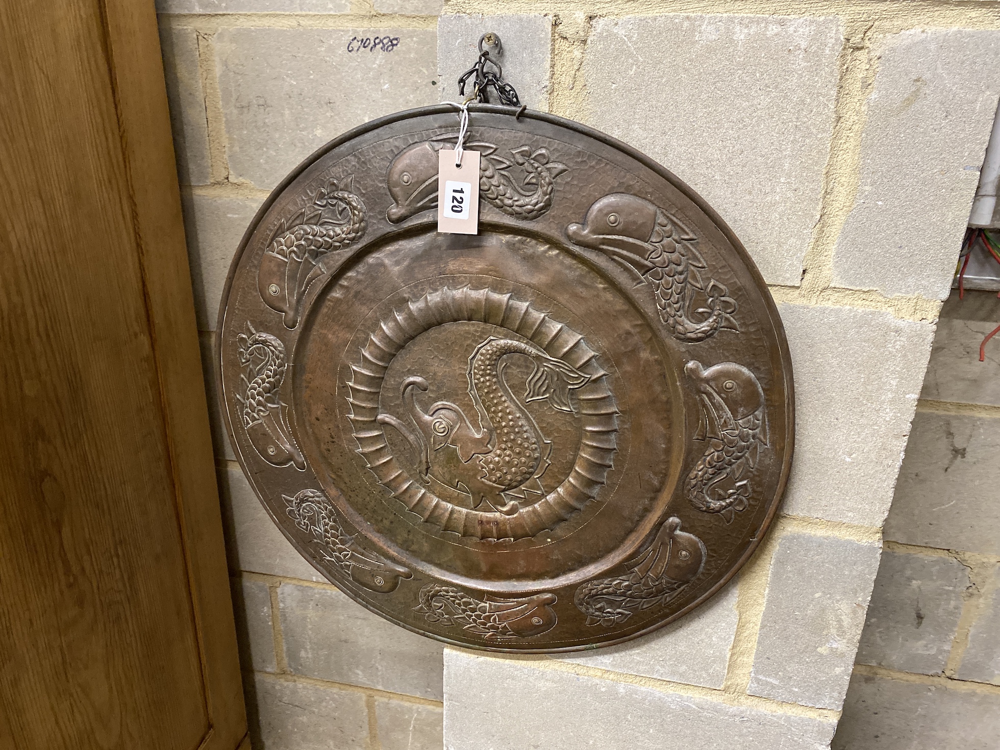 A Newlyn School style circular embossed copper wall plaque, diameter 60cm                                                                                                                                                   