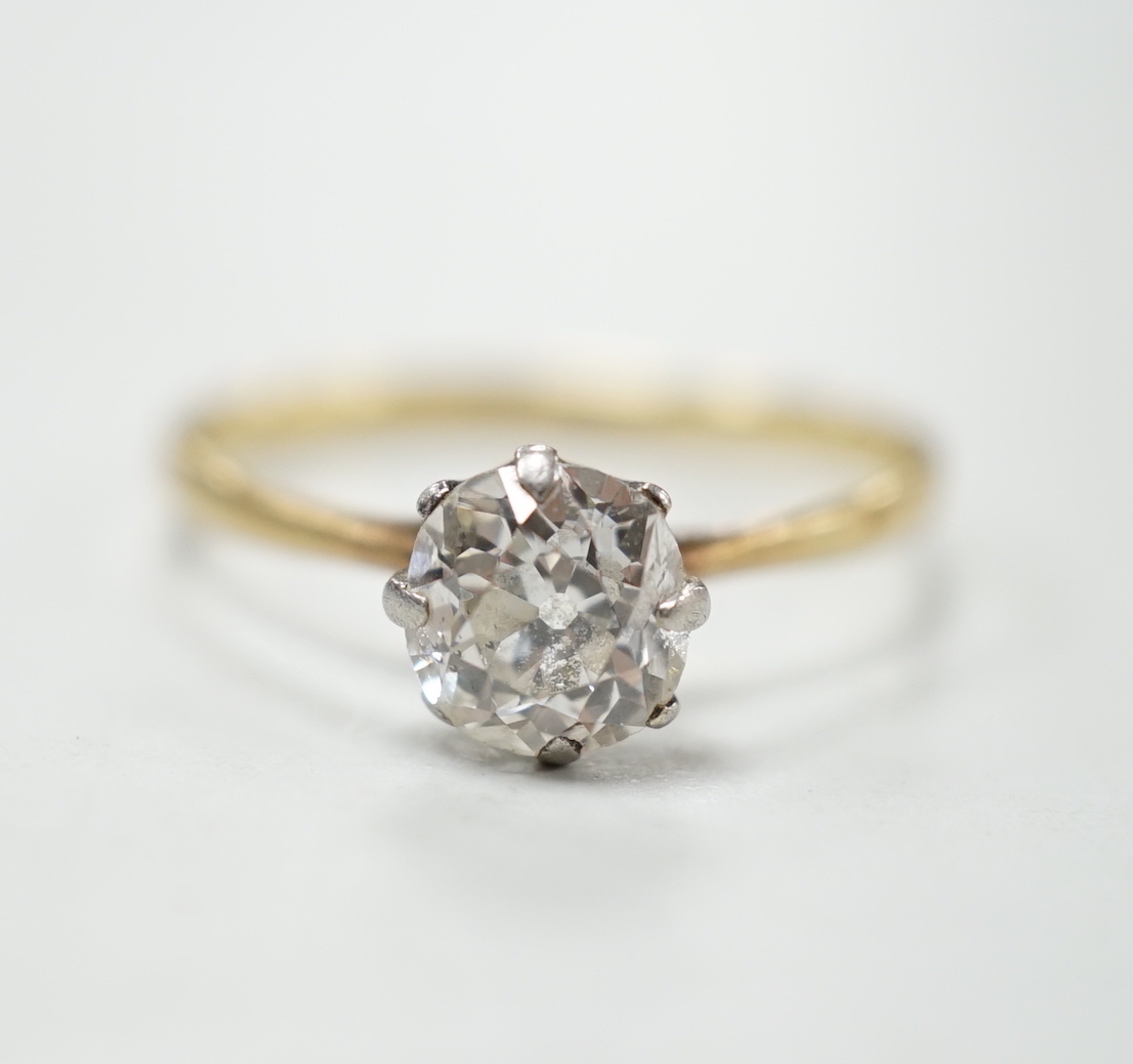 An 18ct, plat and solitaire diamond ring, size M/N, gross weight 1.8 grams, the stone measuring approx. 6.0mm by 5.2mm.                                                                                                     