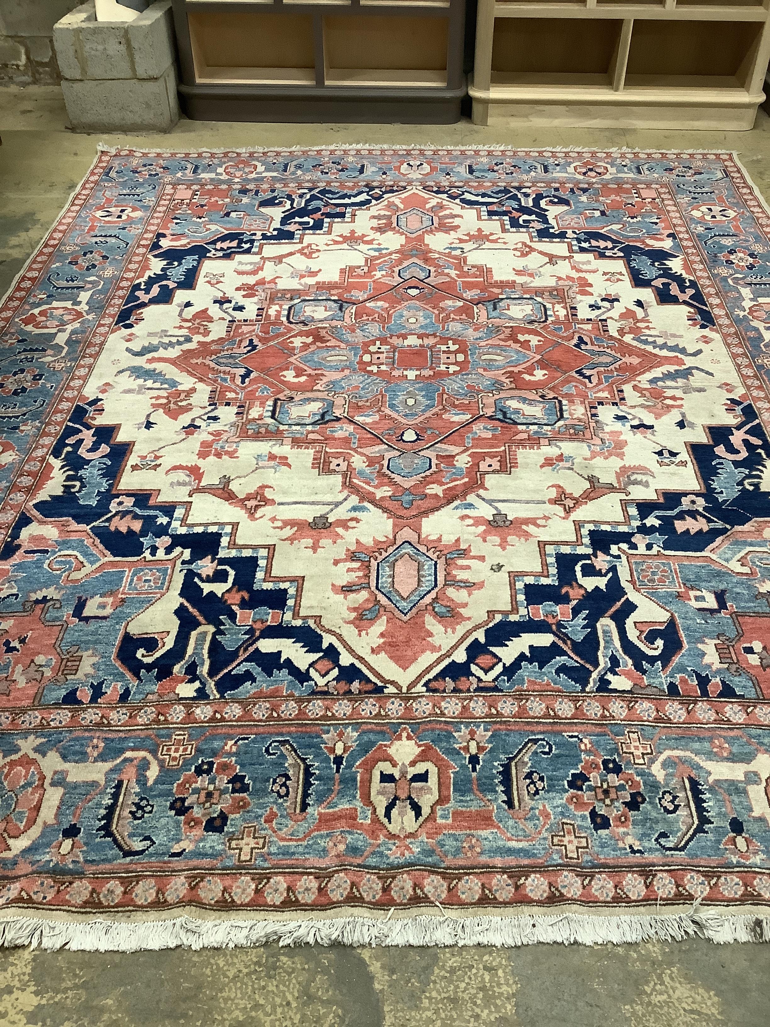 A Heriz ivory ground carpet, 350 x 272cm                                                                                                                                                                                    