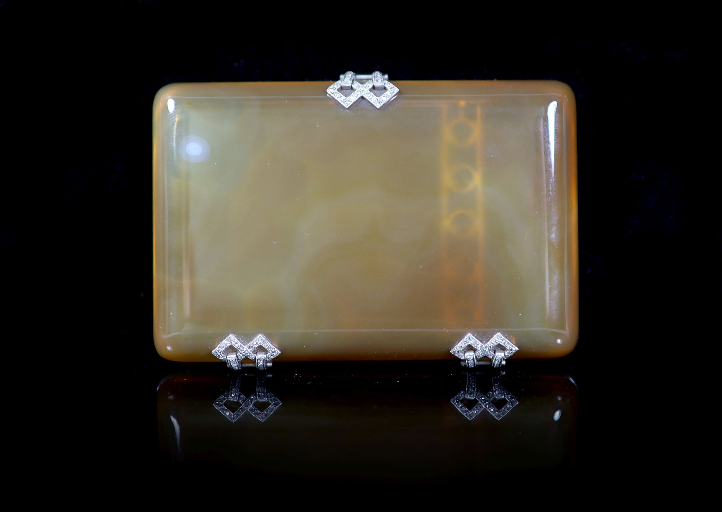 A 1920's French 18ct white gold, platinum and rose cut diamond set two colour agate rounded rectangular cigarette case, by Michel Ballada (Paris 1914-1922)                                                                 