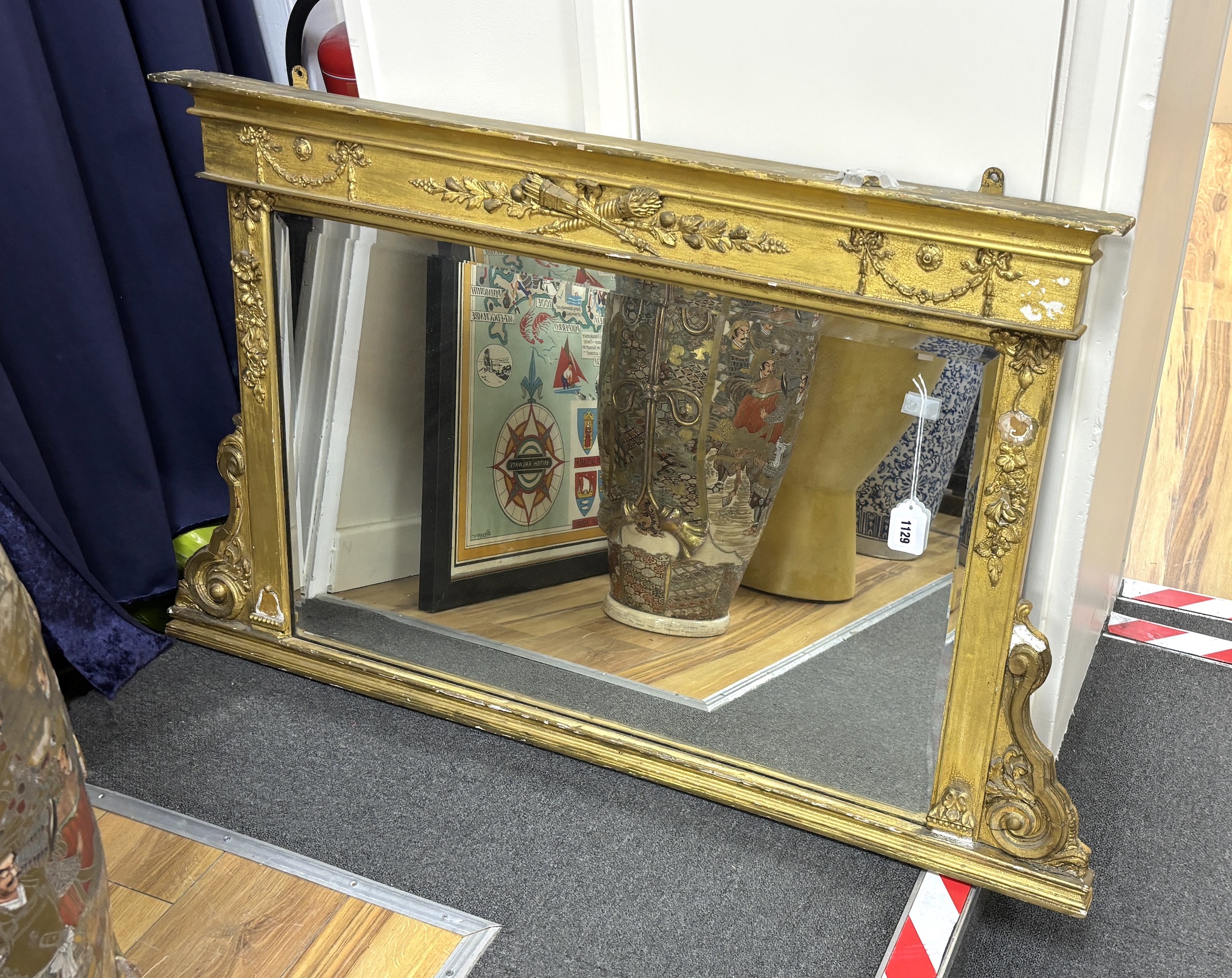 A Regency gilt and composition overmantel mirror, width 120cm, height 70cm                                                                                                                                                  