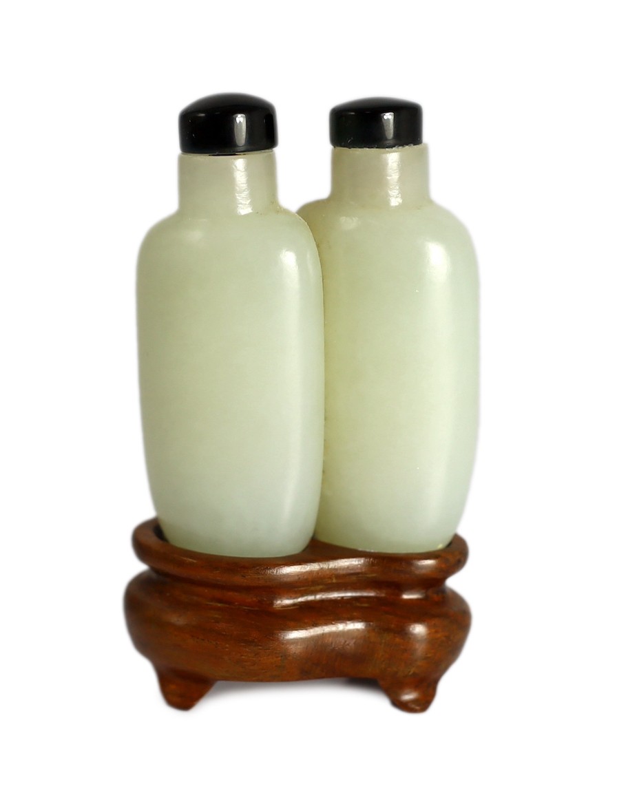 A Chinese pale celadon jade 'double' snuff bottle, 18th/19th century, 5.2cm high                                                                                                                                            