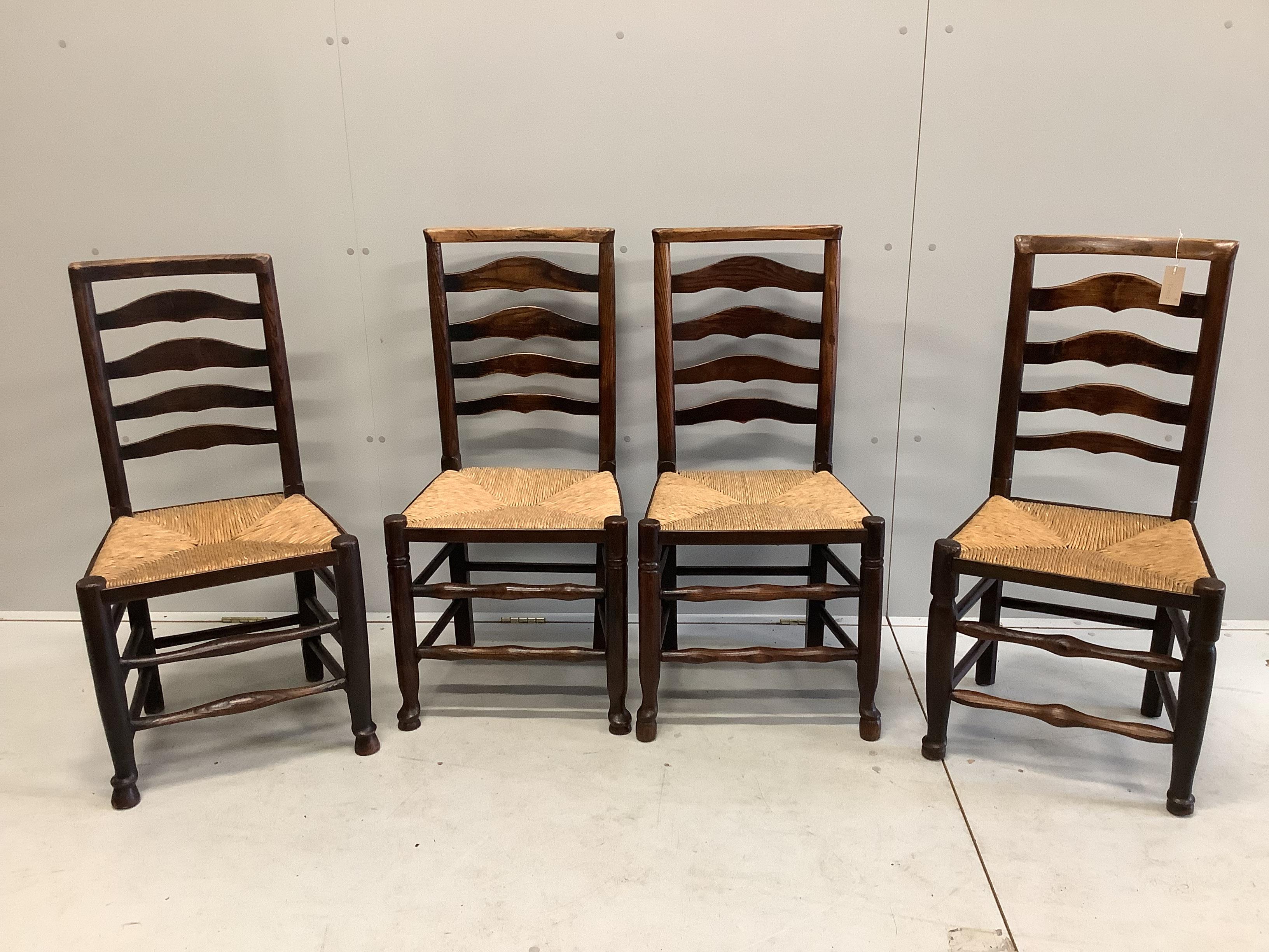 A set of four 18th century rush seat, ladder back dining chairs, width 46cm, depth 38cm, height 95cm                                                                                                                        