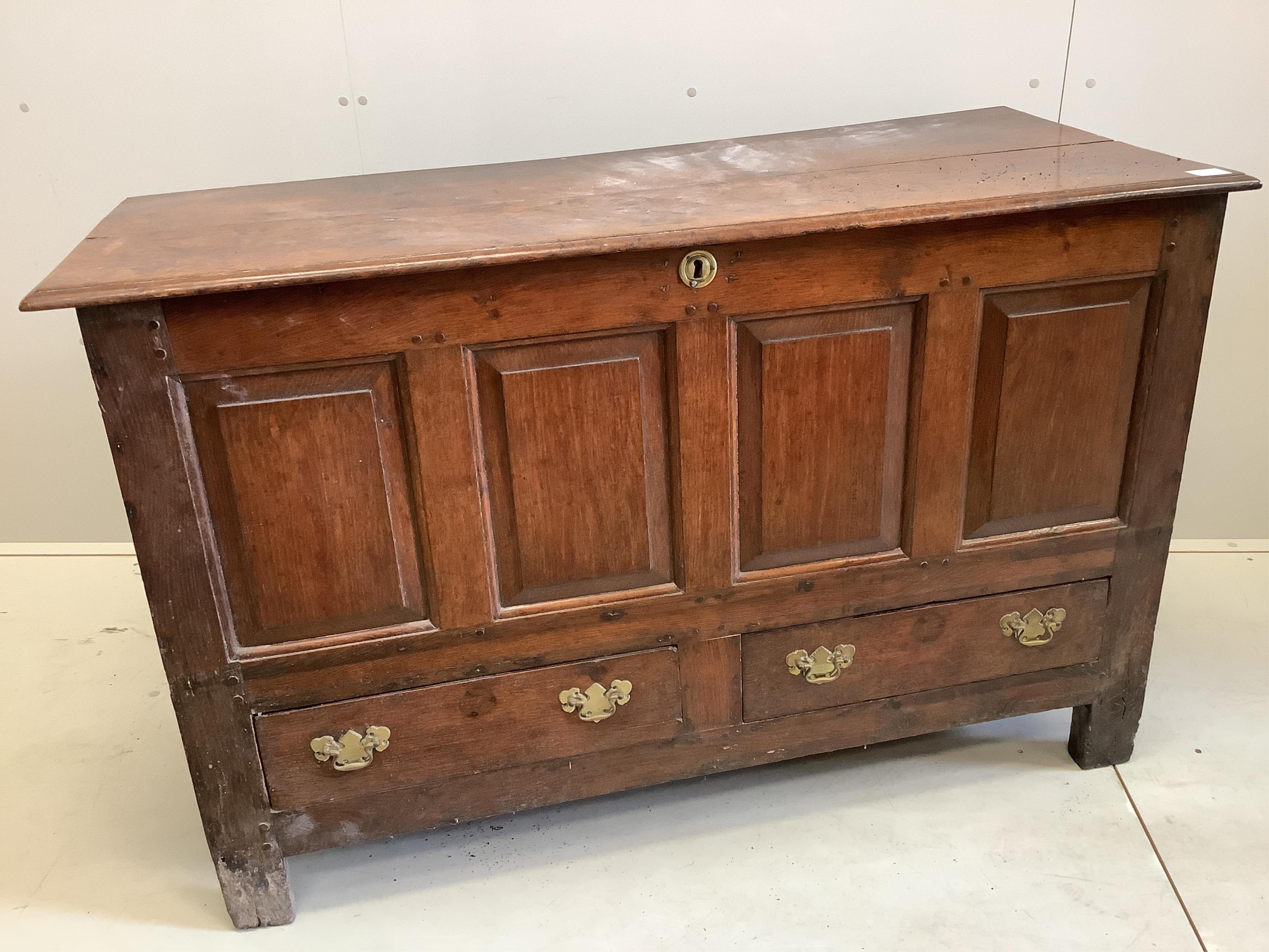 A mid 18th century panelled oak mule chest, width 136cm, depth 58cm, height 87cm. Condition - fair                                                                                                                          