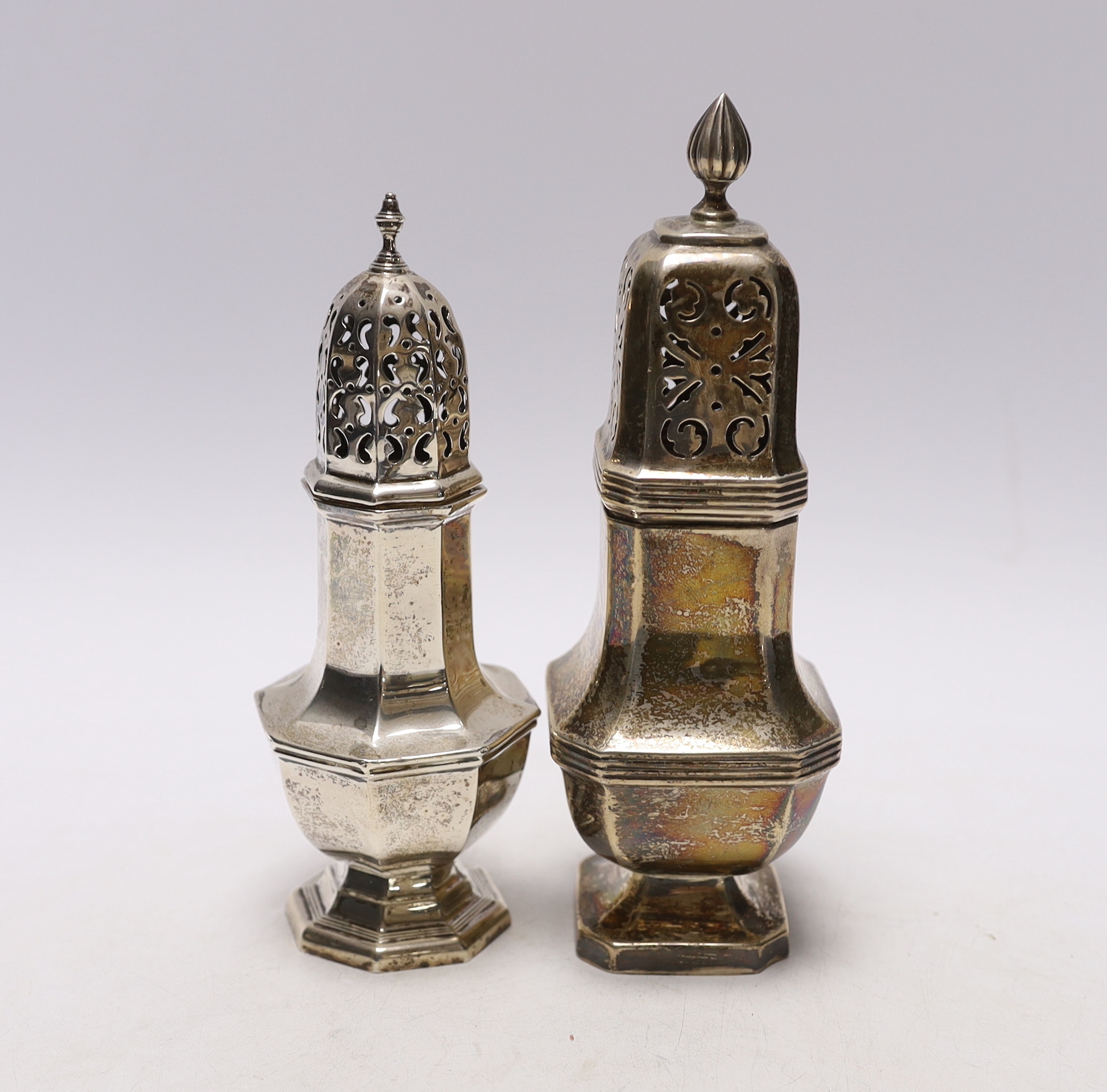 Two George V silver sugar casters, largest 18.4cm, 8.2oz.                                                                                                                                                                   