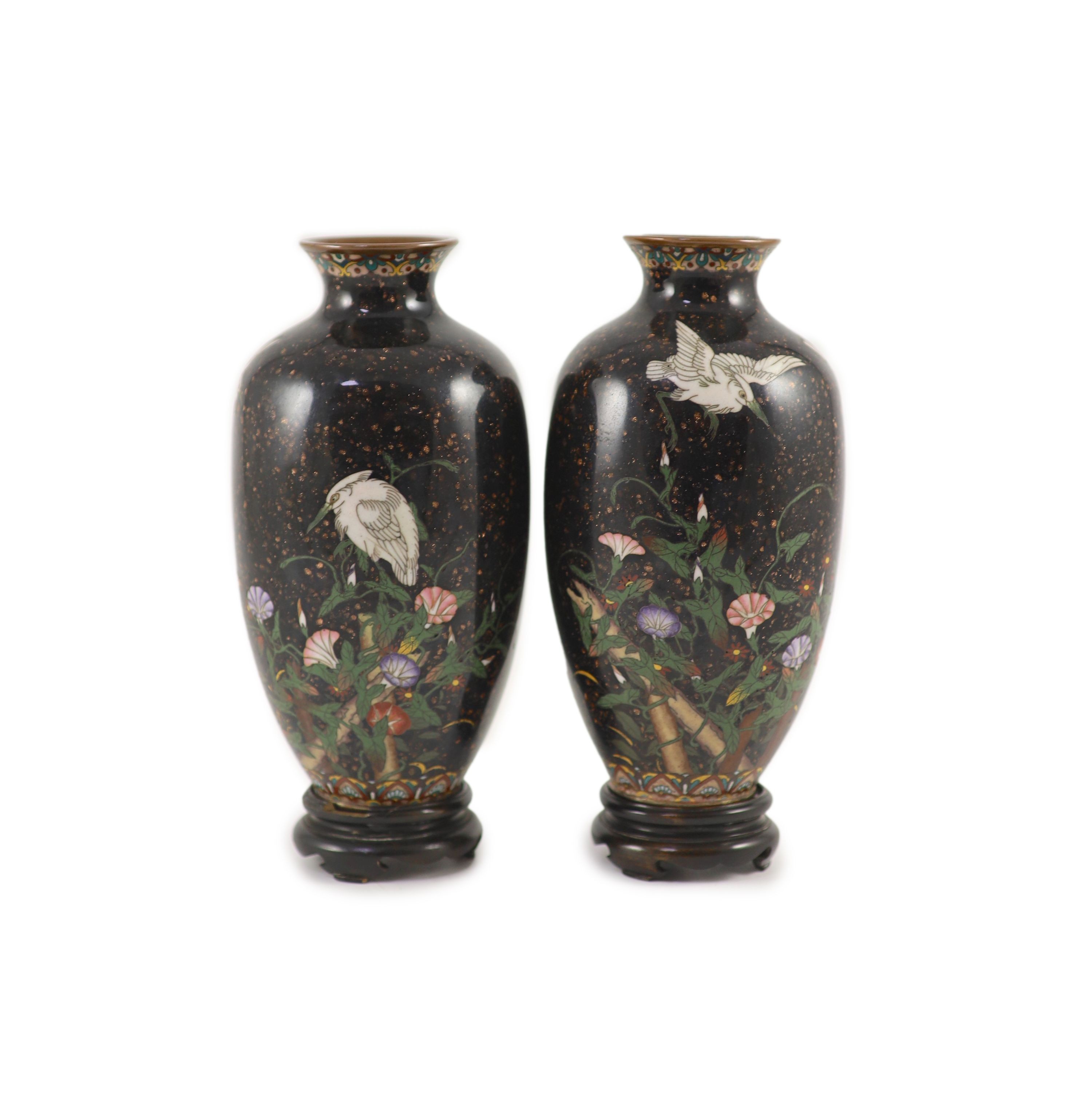 A pair of Japanese silver wire cloisonné enamel ‘egret’ vases, Meiji period, 18.5 cm high, wood stands                                                                                                                      