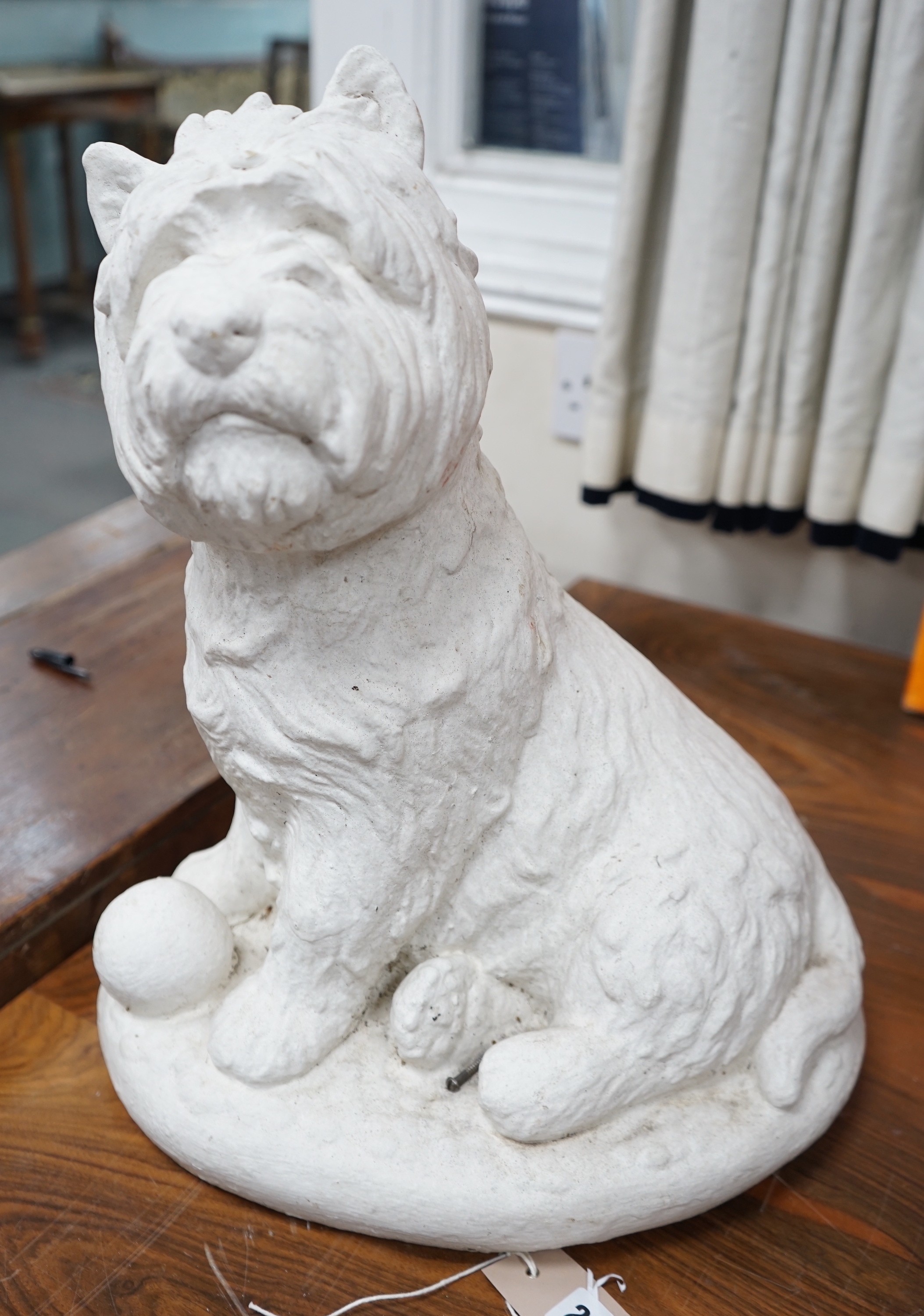A painted carved stone model of a Scottish terrier, height 46cm                                                                                                                                                             