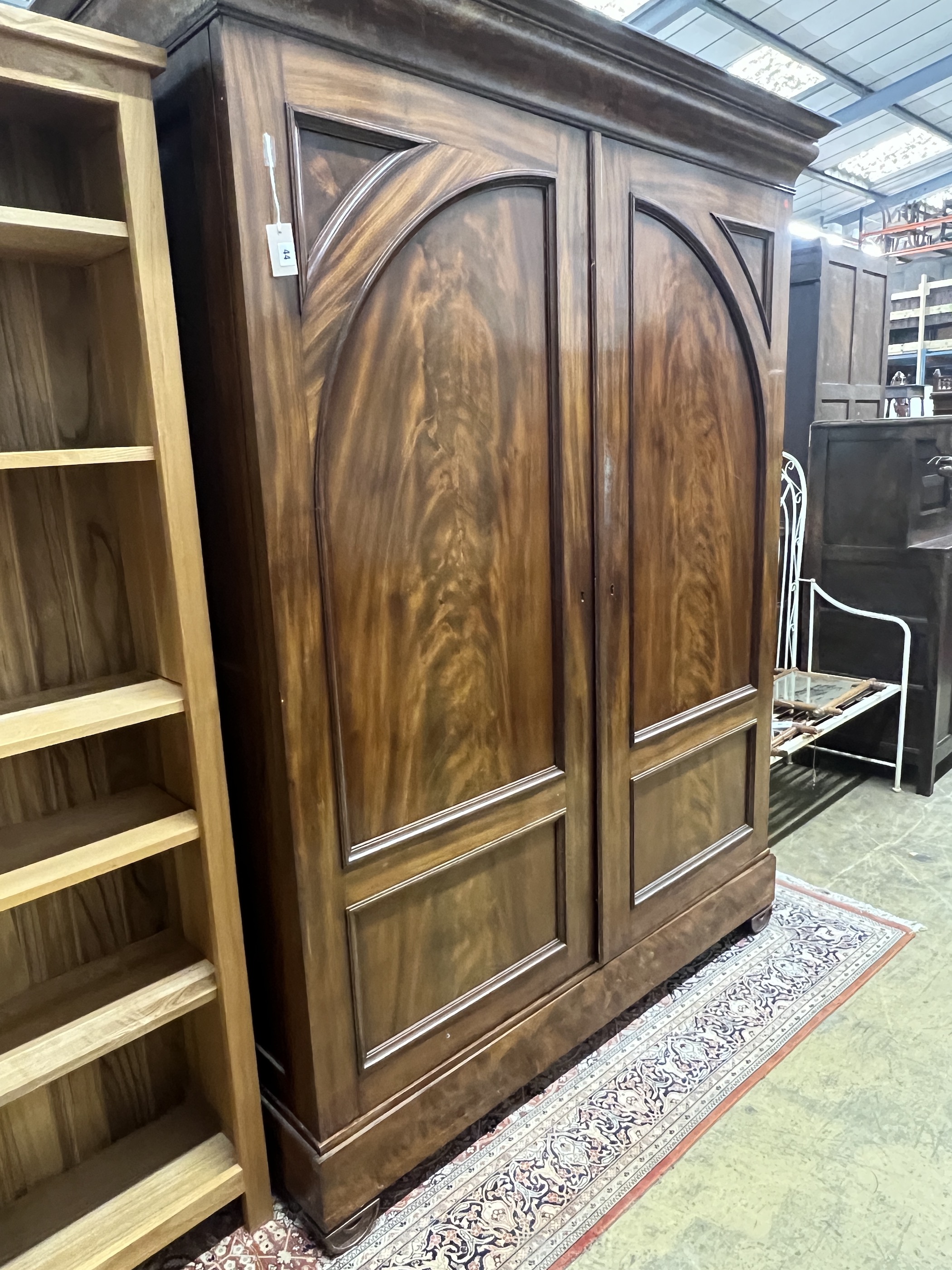 A 19th century Continental mahogany two door wardrobe, width 170cm, depth 62cm, height 218cm                                                                                                                                