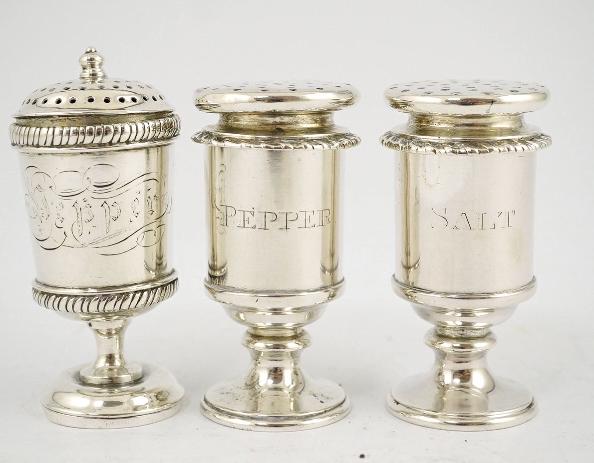 A pair of Hamilton & Co. Anglo-Indian silver pepper pots and a similar unmarked pepper pot, c.1800, tallest 9.4cm, 299g gross. Condition - fair                                                                             