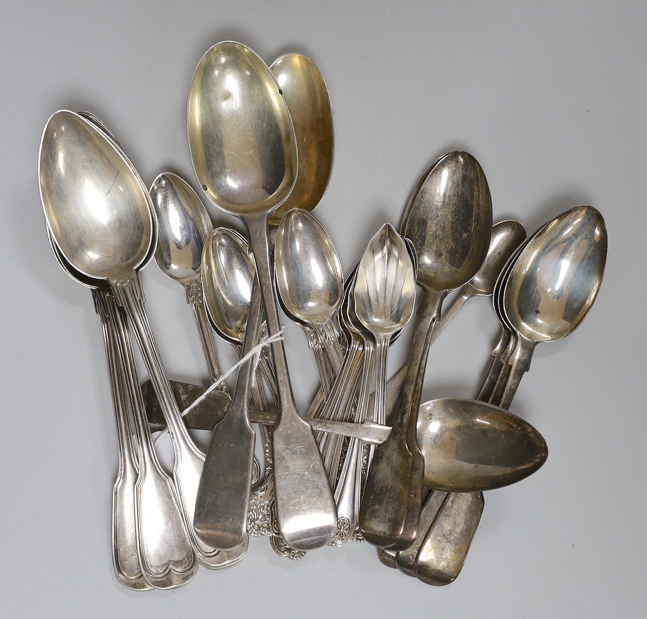 A set of six Victorian silver fiddle pattern dessert spoons, Charles Lias, London, 1845, a set of six silver Queens pattern teaspoons, John James Whiting, London, 1852, set of six later silver grapefruit spoons, three ot