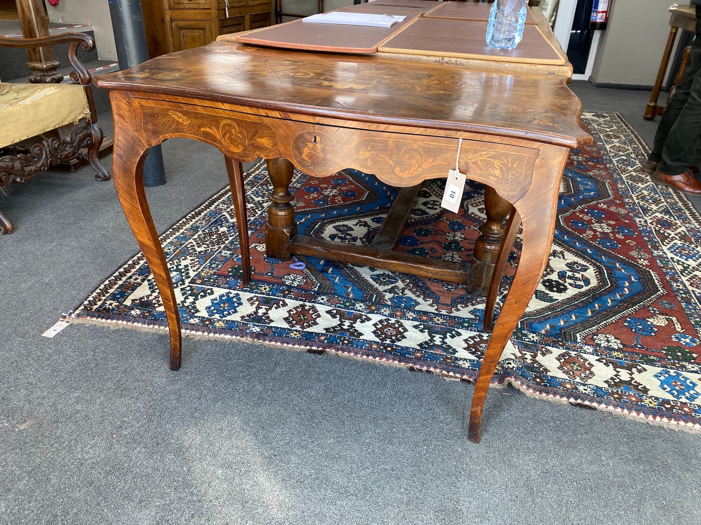 A Victorian walnut and marquetry inlaid rectangular serpentine centre table, width 90cm, depth 52cm, height 75cm                                                                                                            