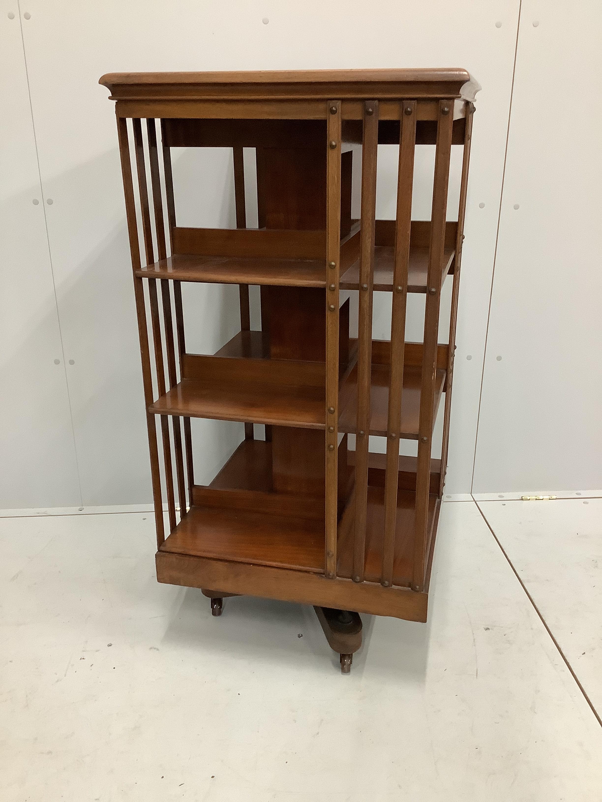 An early 20th century mahogany three tier revolving bookcase, width 60cm, depth 60cm, height 120cm                                                                                                                          