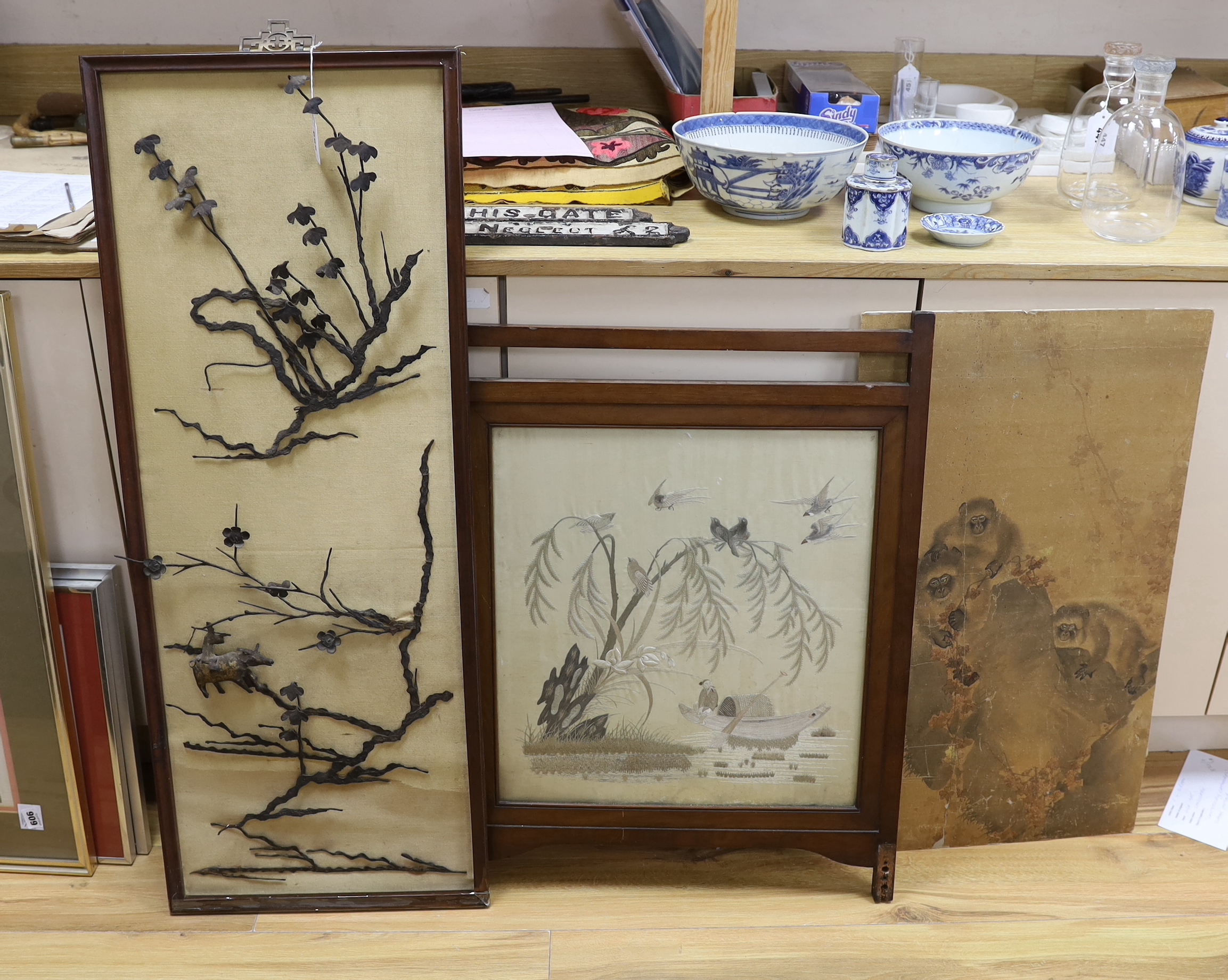 A Chinese ironwork panel, frame 108 cm high, 43 cm wide an embroidered silk panel and a Japanese painting of monkeys                                                                                                        