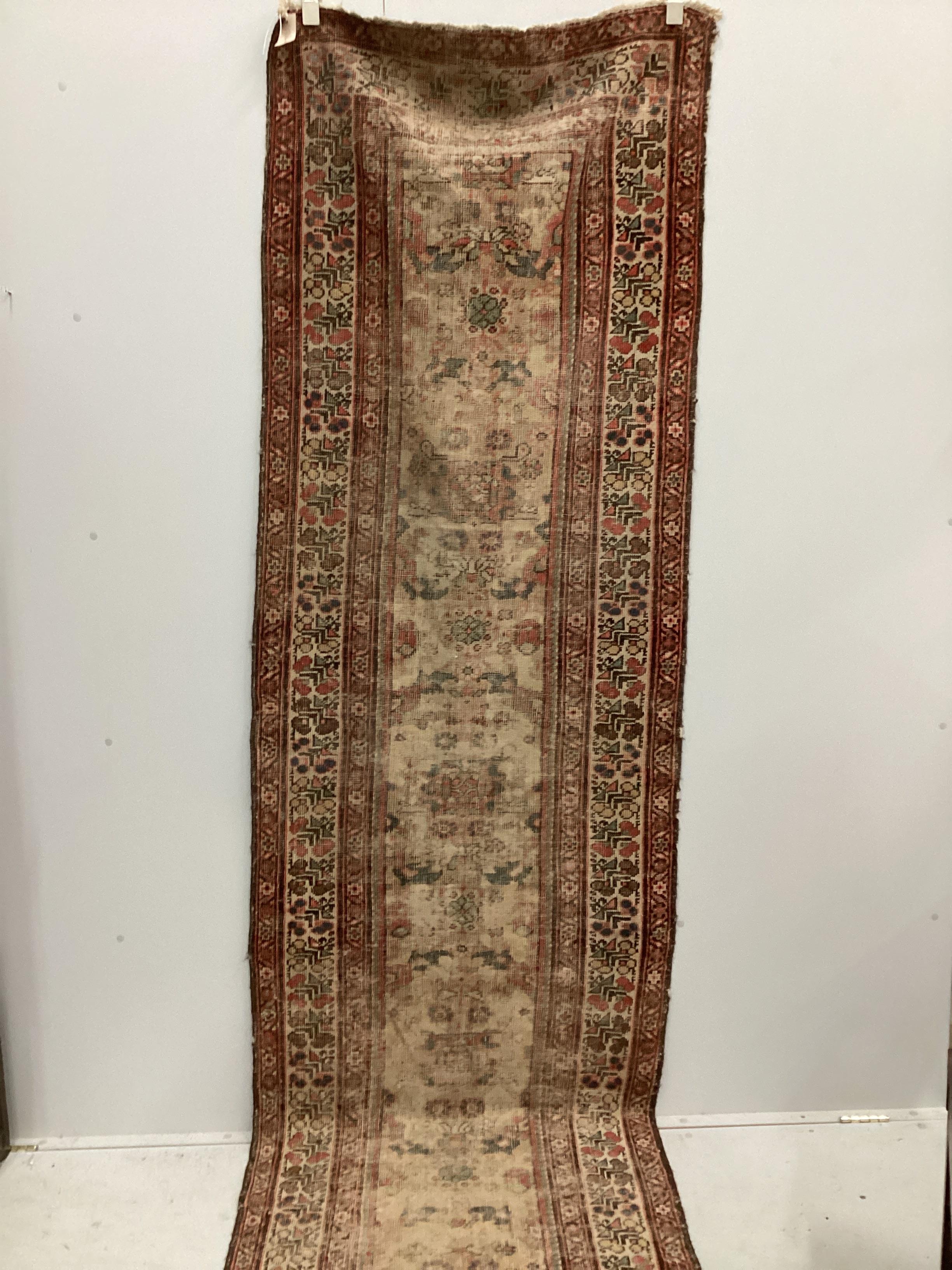 An antique North West Persian ivory ground runner (severely worn), 470 x 92cm                                                                                                                                               