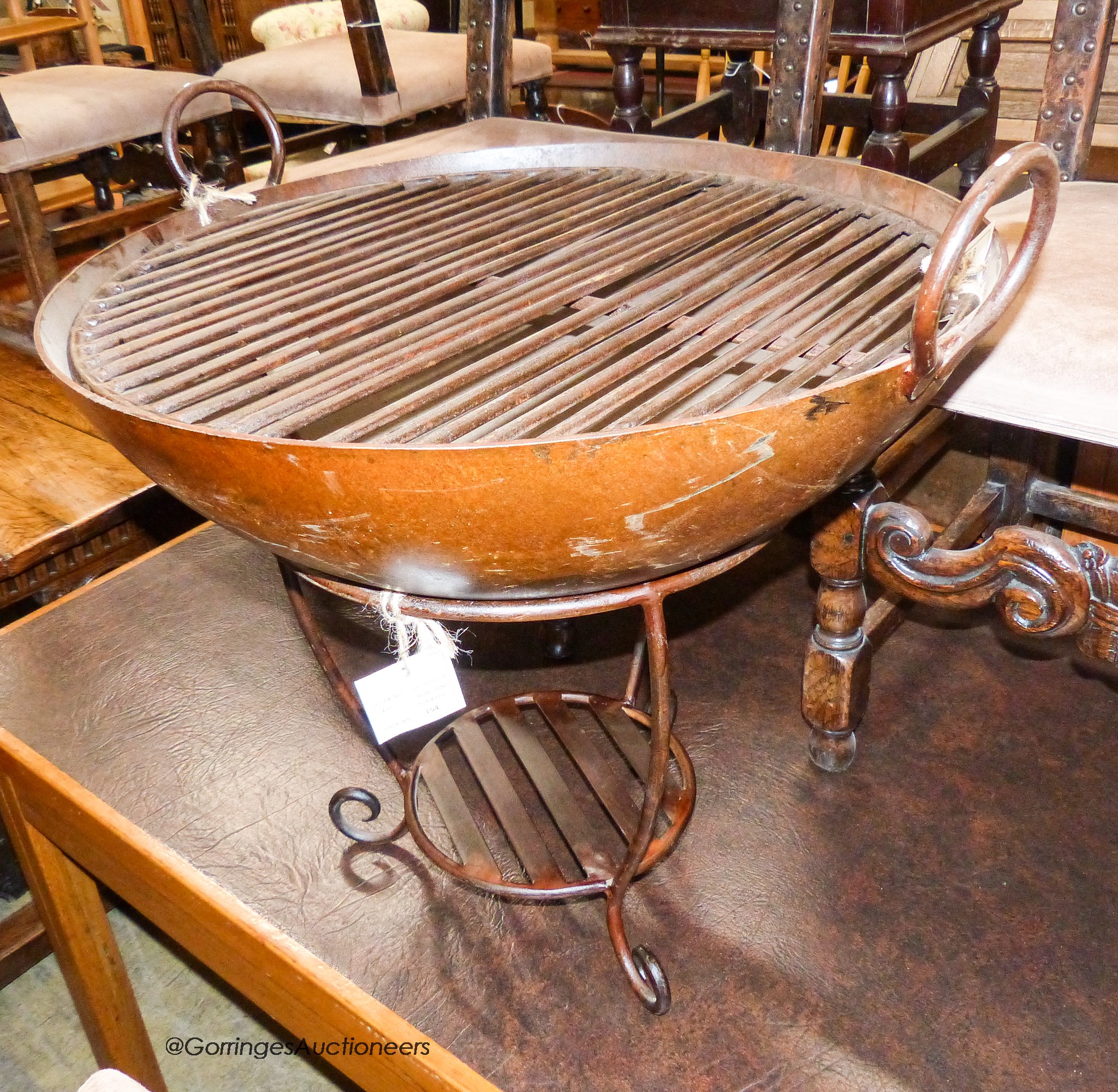 A cast iron fire pit with grill, diameter 67cm, height 65cm                                                                                                                                                                 