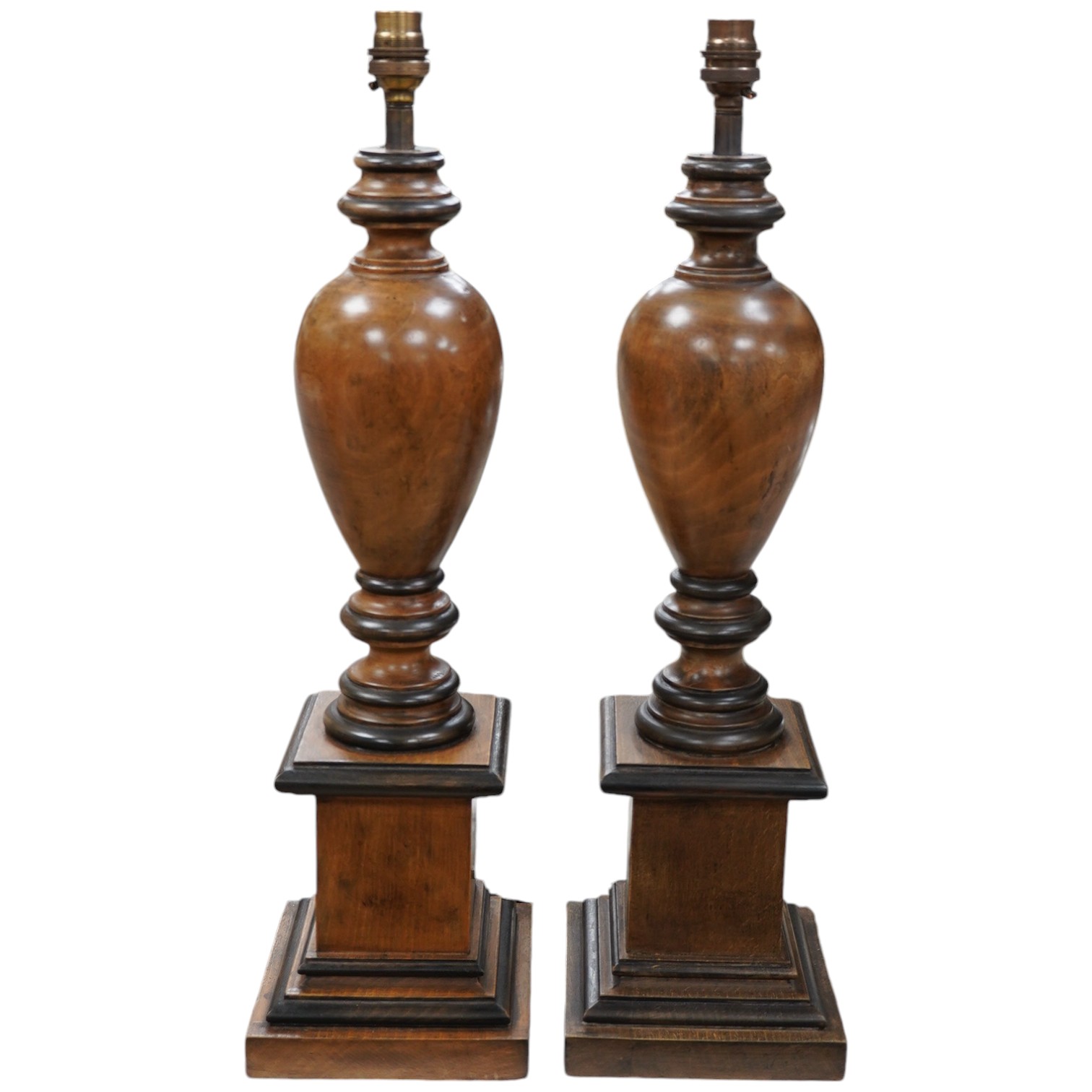 A pair of vintage English carved wood table lamps, wired, 54cm high to top of bulb holder, 55cm high. Condition - good                                                                                                      