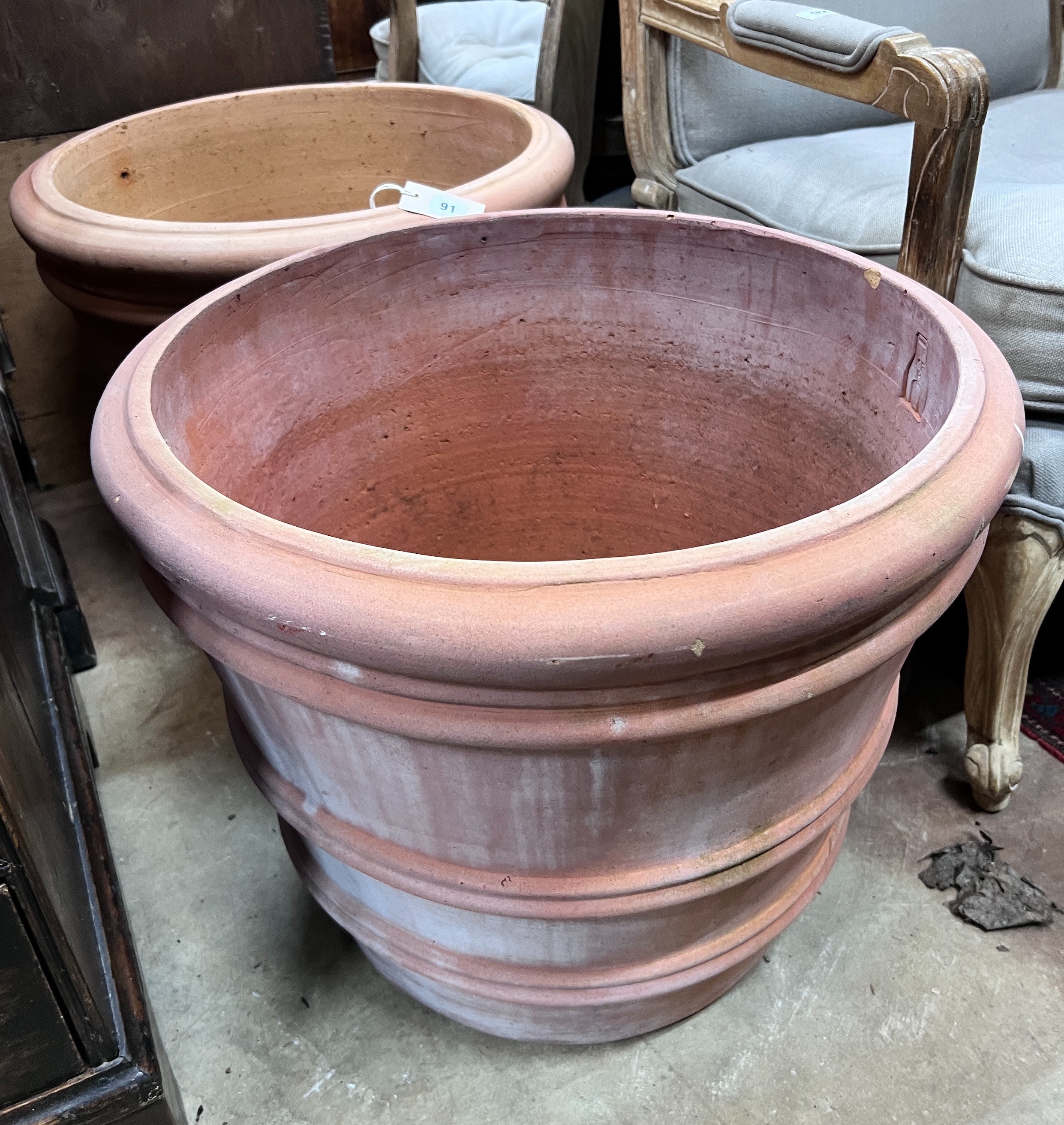 A pair of circular Italian terracotta planters, diameter 55cm, height 46cm *Please note the sale commences at 9am.                                                                                                          