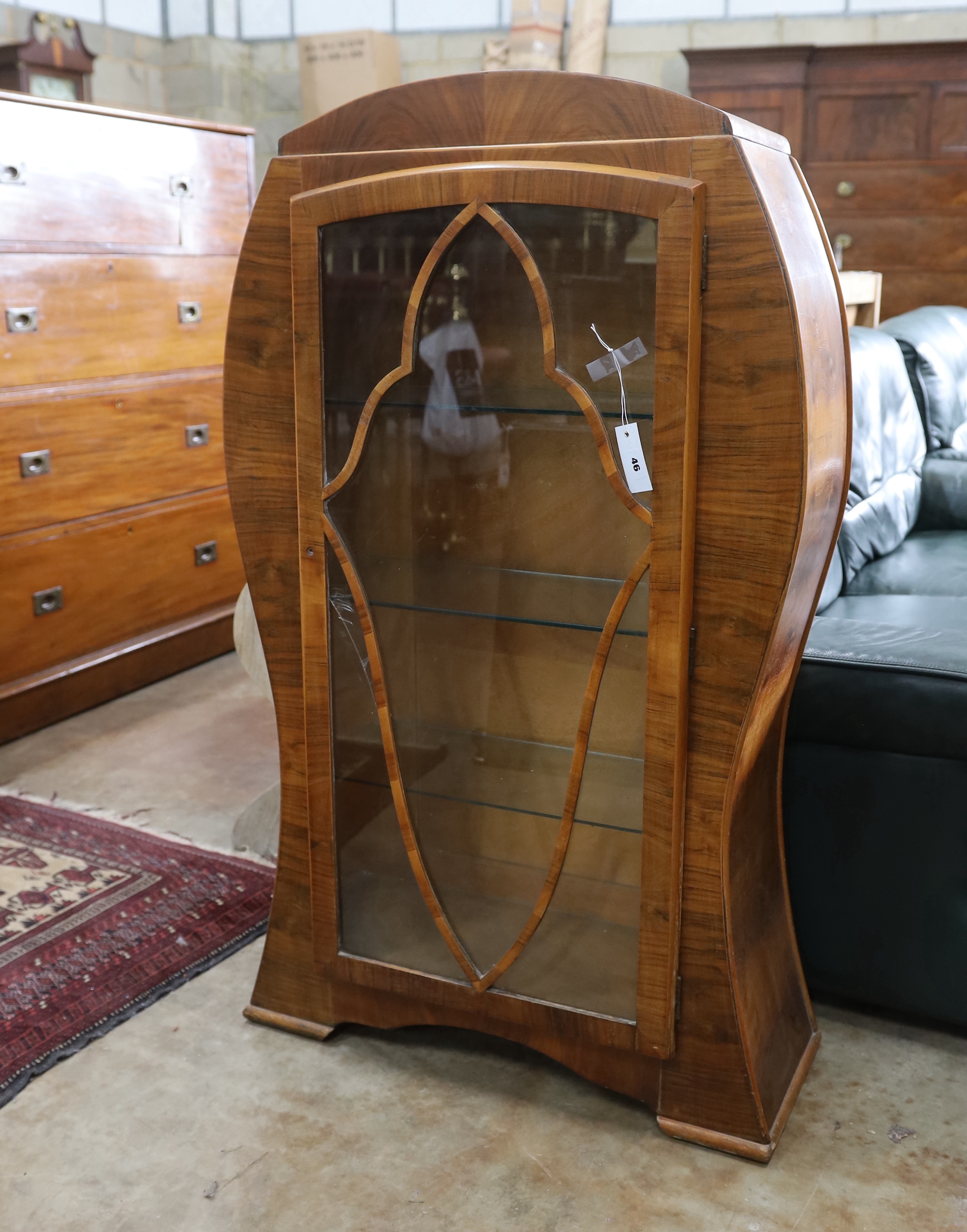 An Art Deco style walnut display cabinet, width 70cm, depth 26cm, height 119cm                                                                                                                                              