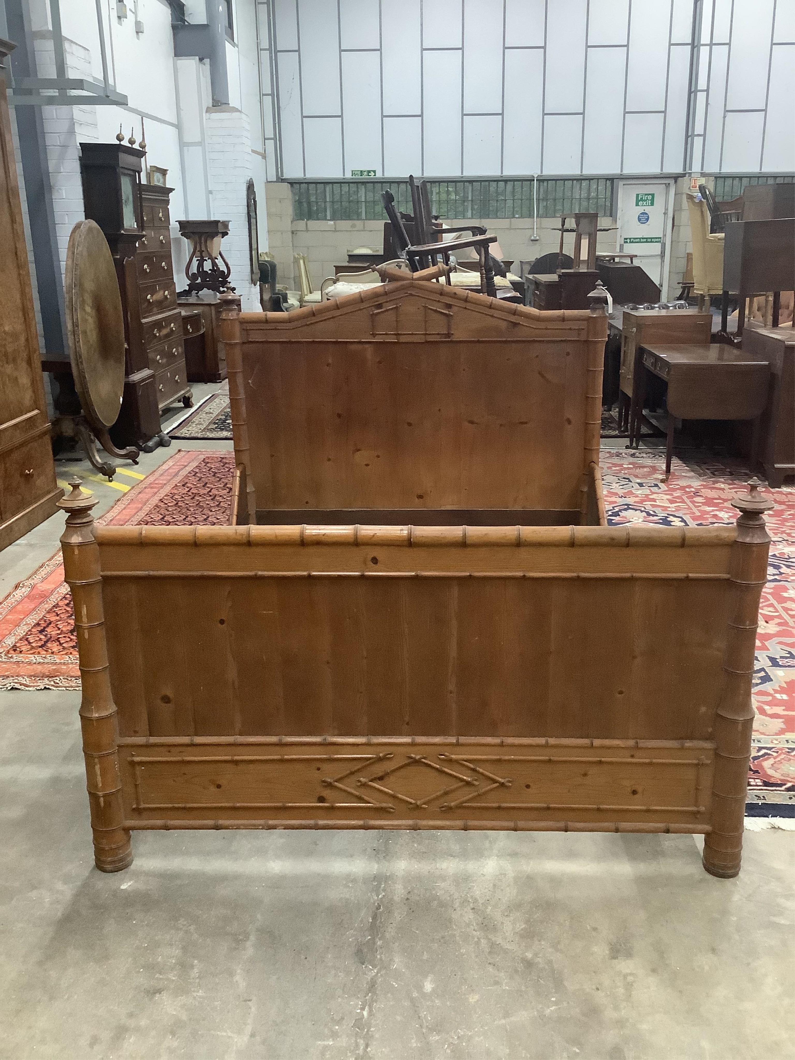 A 19th century French pine faux bamboo double bedframe, width 150cm, length 190cm, height 130cm. Condition - fair                                                                                                           