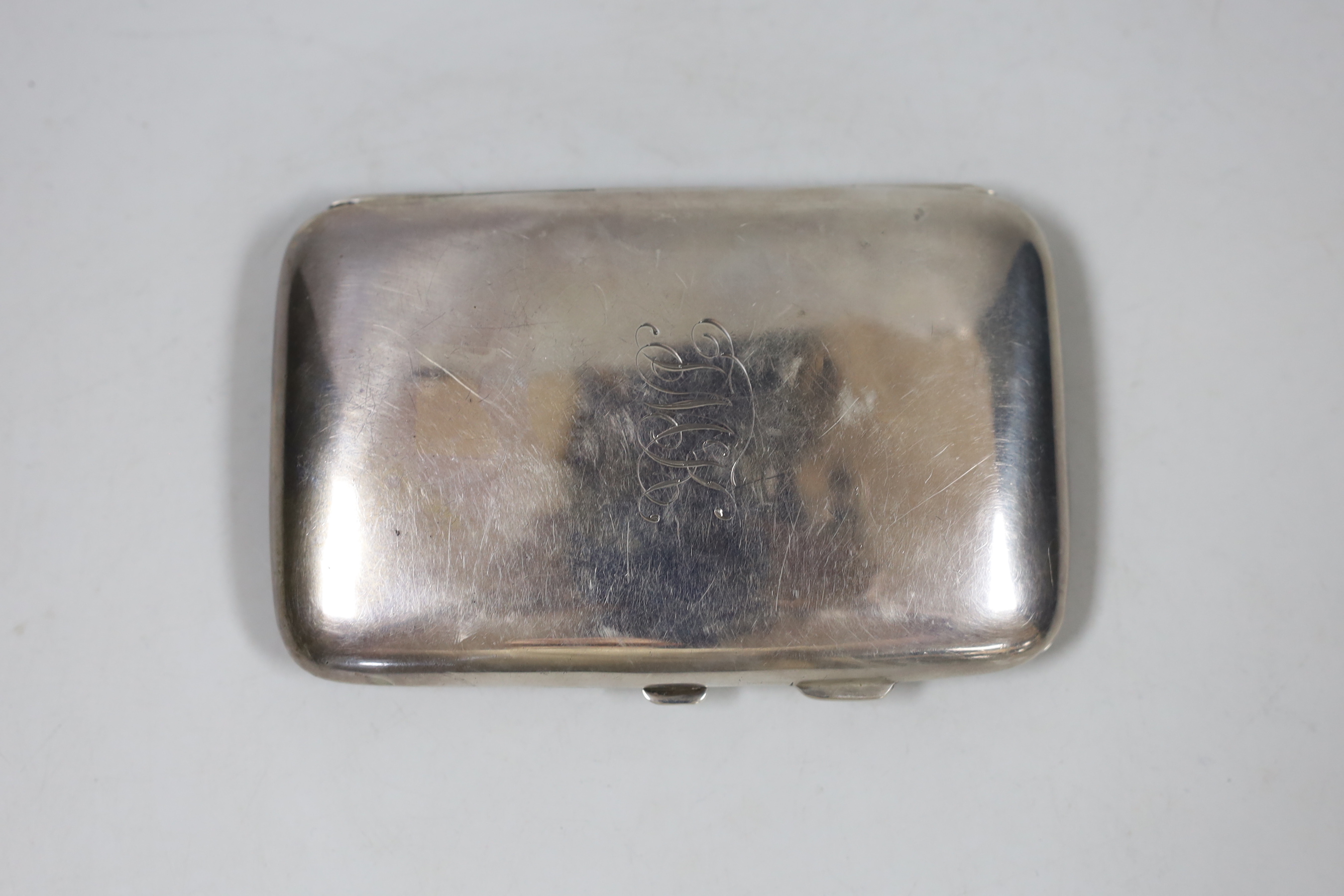 A George V silver cigar case, Birmingham, 1919, 13.7cm, 5.3oz.                                                                                                                                                              