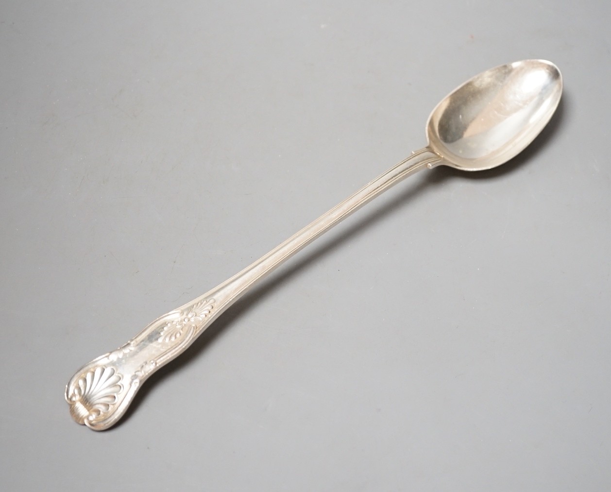 An Edwardian silver Kings pattern basting spoon, John Round, Sheffield, 1905, 34.6cm, 237 grams.                                                                                                                            