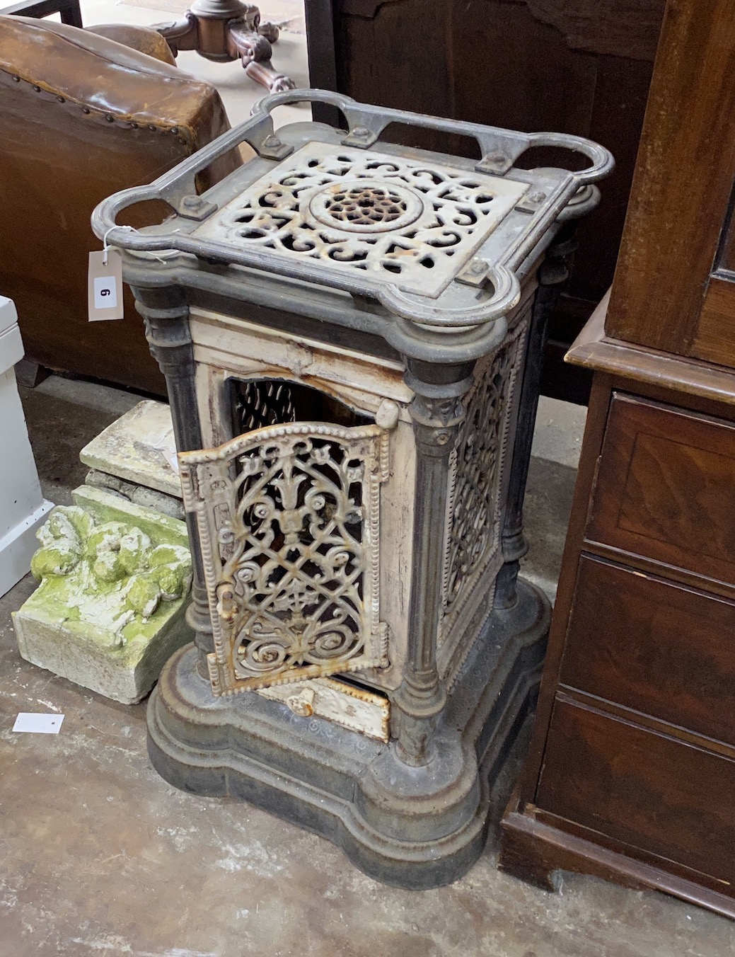 A 19th century French enamelled cast iron conservatory heater, lacking burner, width 44cm, height 85cm                                                                                                                      