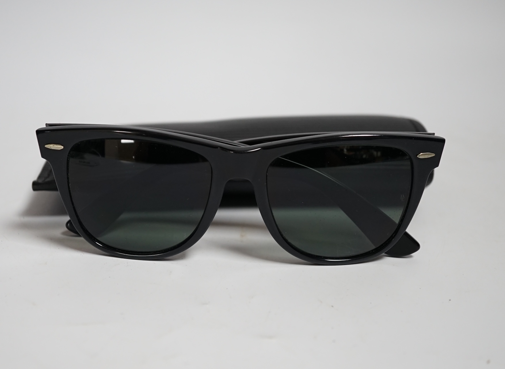 A pair of vintage Ray Ban Wayfarer sunglasses, with case and box, virtually unused.                                                                                                                                         