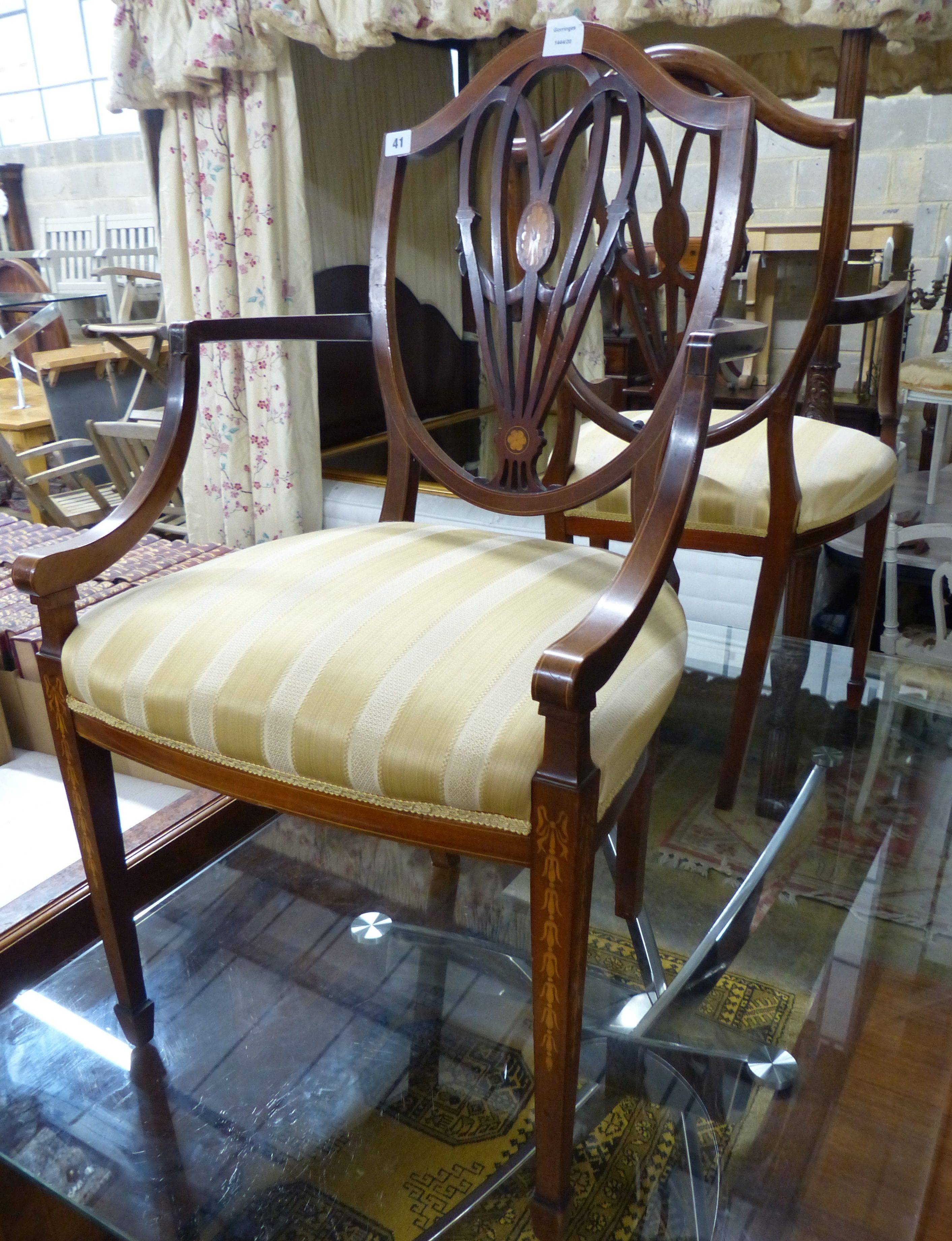 A pair of Edwardian Sheraton revival inlaid mahogany shield back elbow chairs (one a.f.)                                                                                                                                    