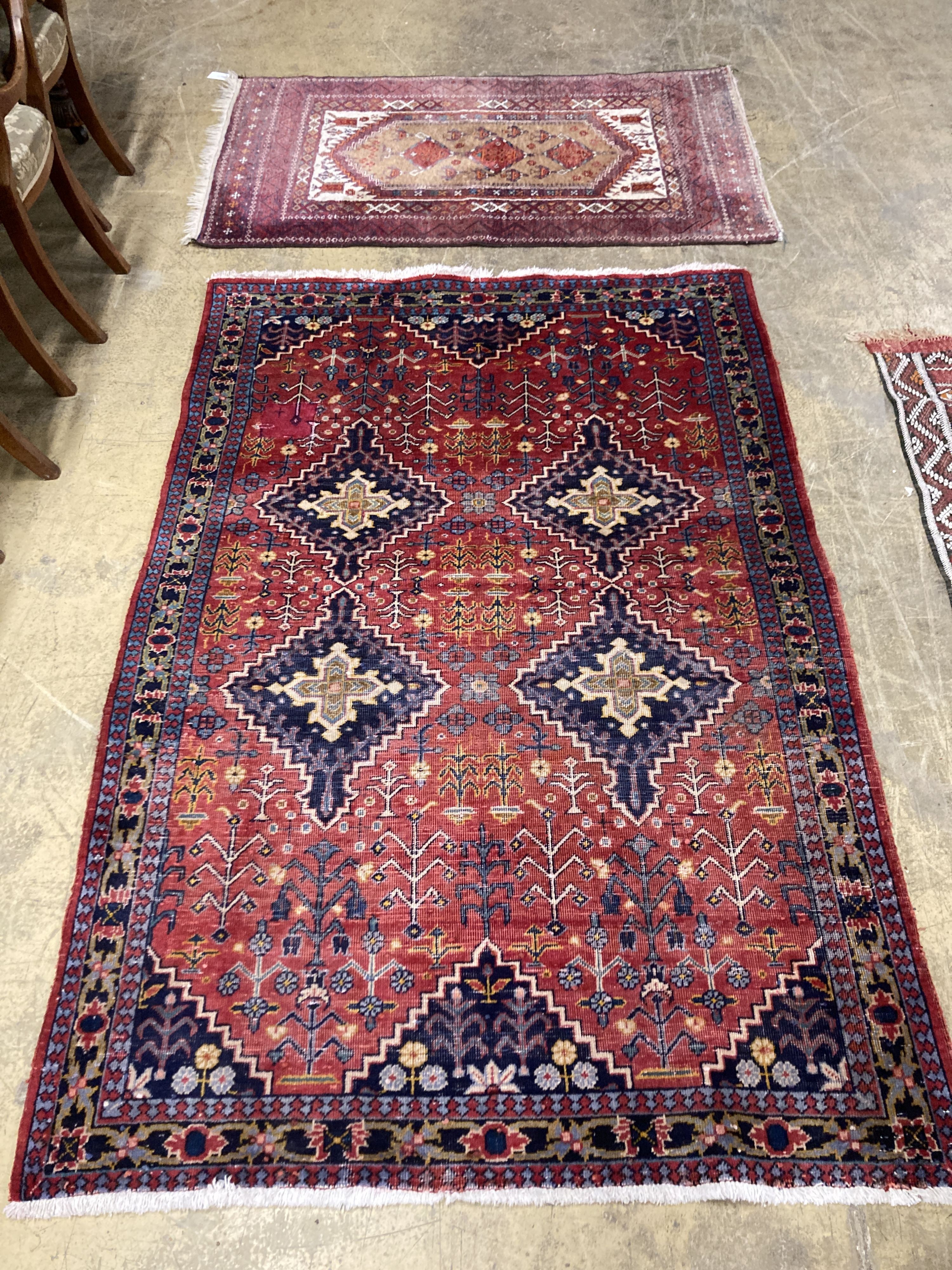 A Caucasian design red ground rug, 206 x 134cm together with a smaller West Persian design rug                                                                                                                              