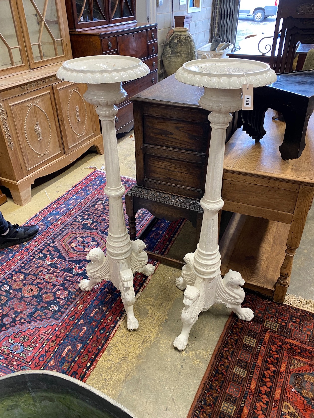 A pair of Victorian style painted cast iron pricket candlestands, height 122cm                                                                                                                                              