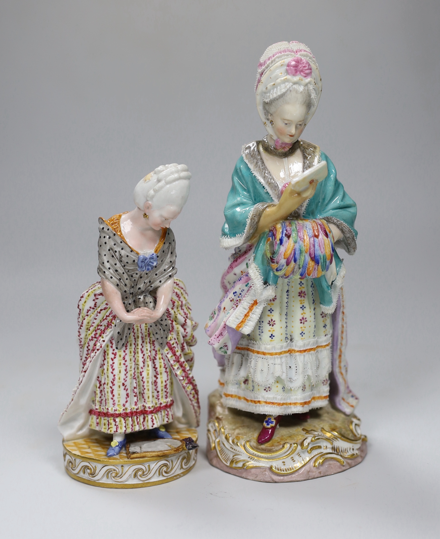 A Meissen figure of a lady standing over a broken mirror, crossed sword mark and further incised mark F.34 to underside, together with another Meissen figure, a lady contemplating a letter (with restoration), marked to u