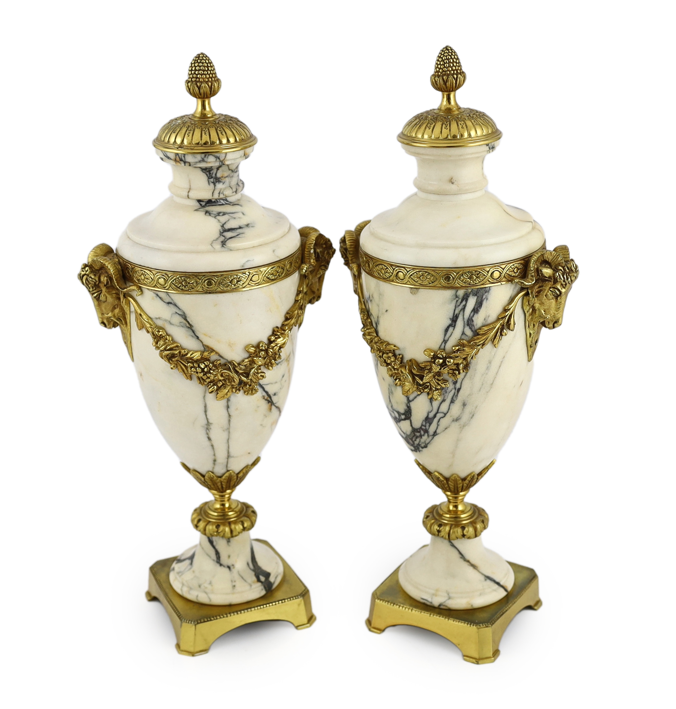 A pair of Italian ormolu mounted calacaita marble urns, 19cm wide, 44cm high                                                                                                                                                