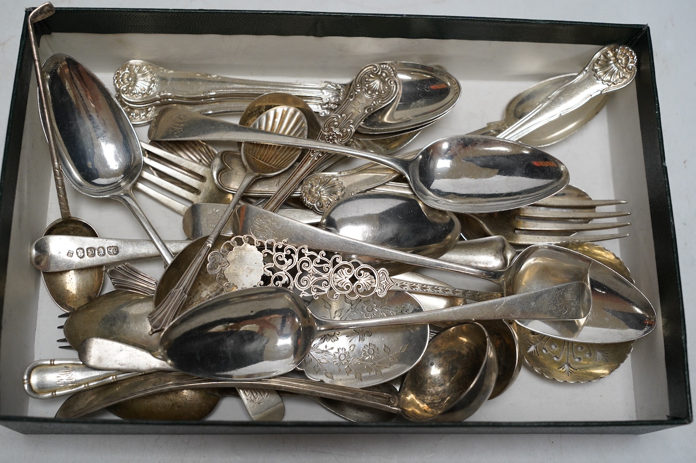 A set of six George III silver Old English pattern dessert spoons, Soloman Hougham, London 1802, a set of six later silver teaspoons, London, 1842 and a quantity of assorted silver flatware, 28.2oz. Condition - poor to f